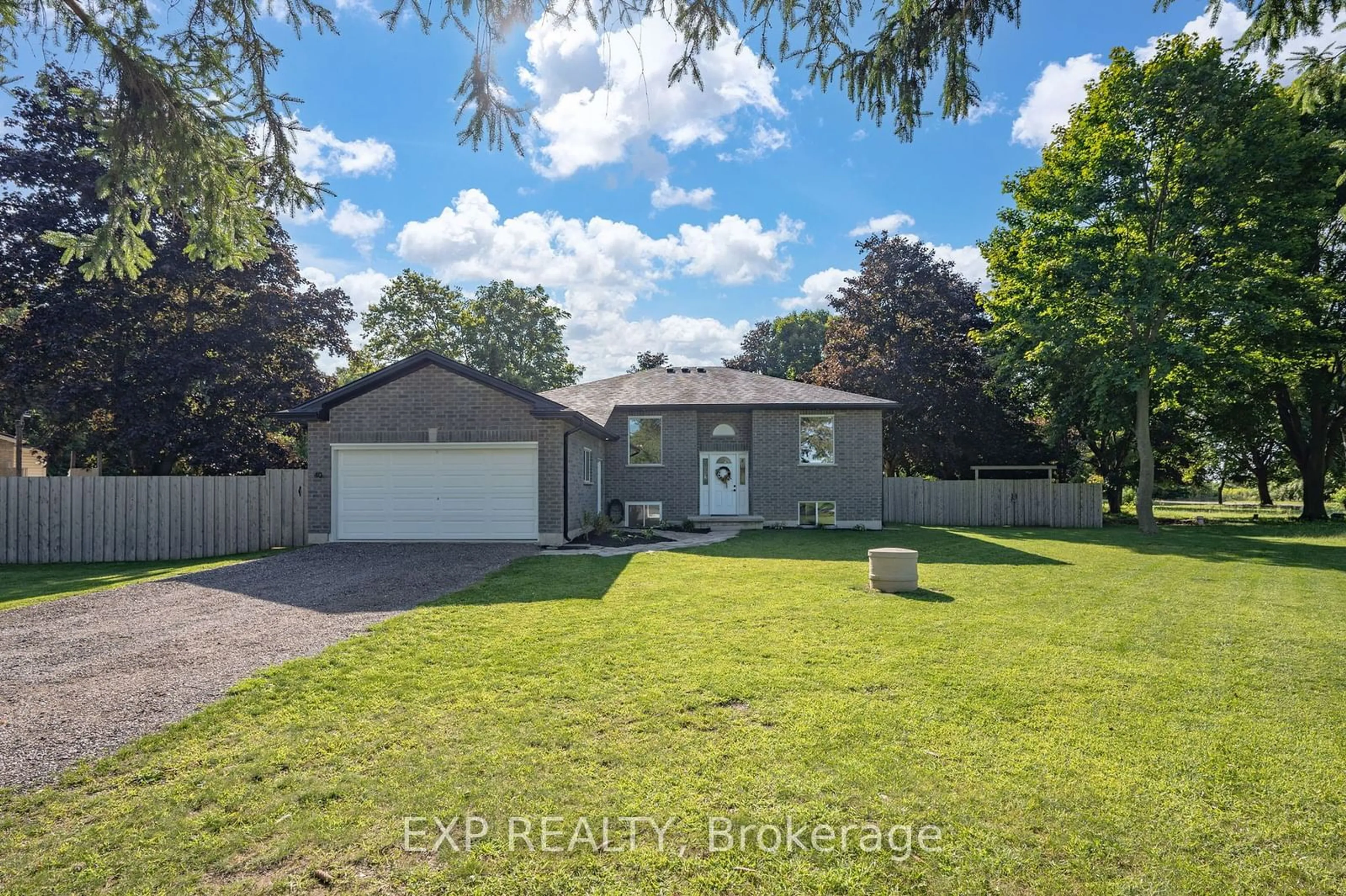 Frontside or backside of a home, the fenced backyard for 40 Middlemiss Ave, Southwest Middlesex Ontario N0L 1T0