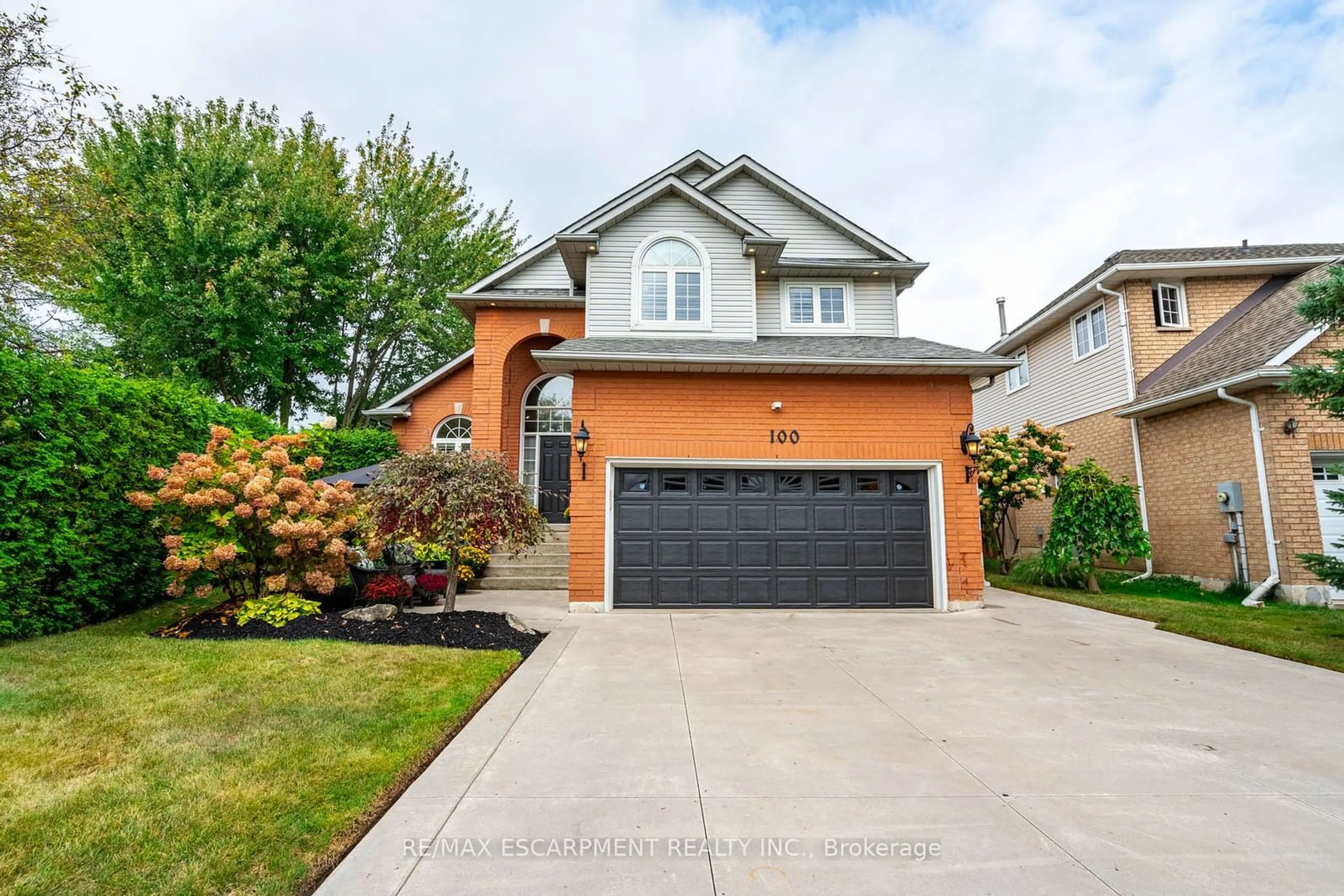 Frontside or backside of a home, the street view for 100 Boulding Ave, Hamilton Ontario L8B 0M1