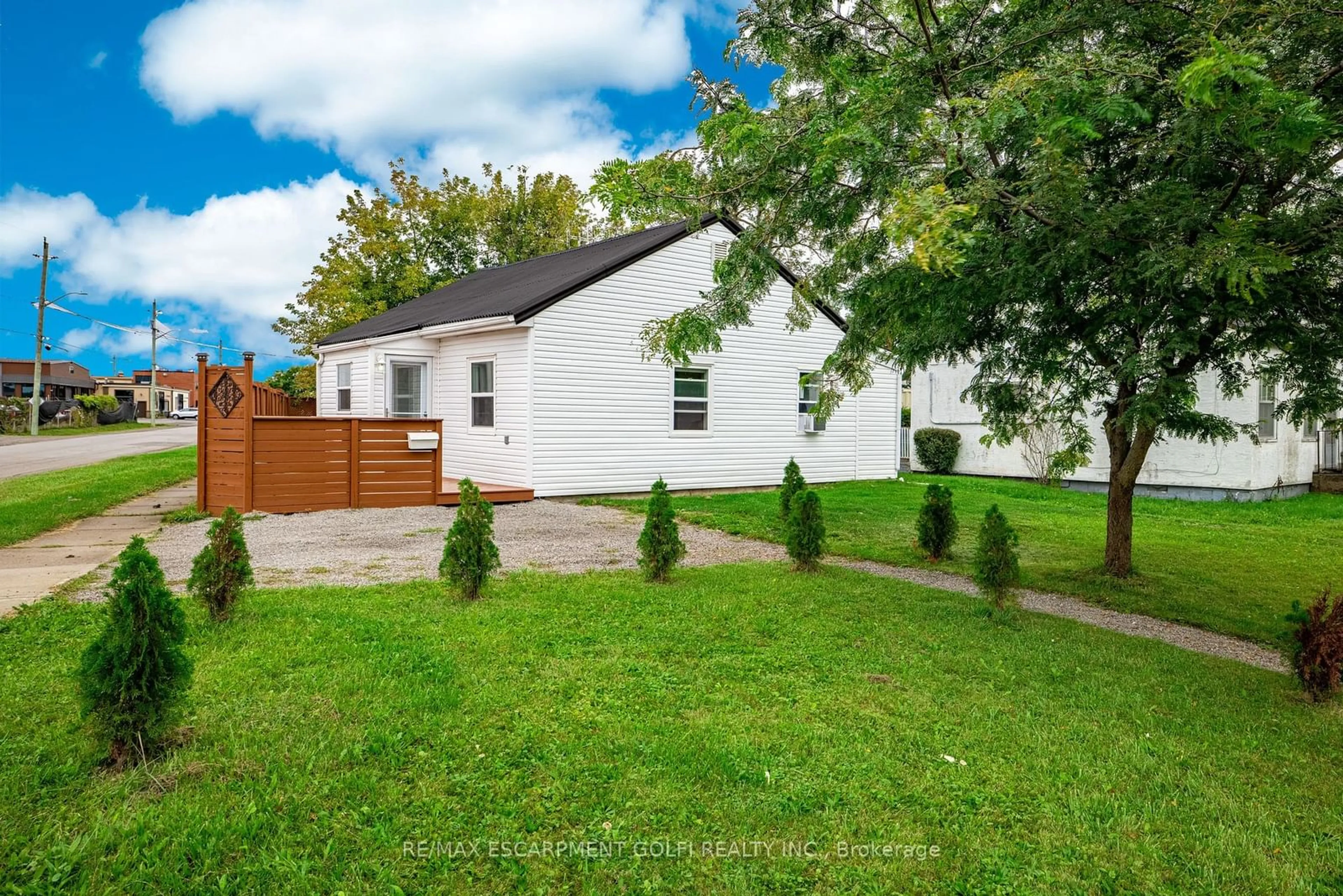 Frontside or backside of a home, the fenced backyard for 1 Plymouth Ave, St. Catharines Ontario L2R 2X8