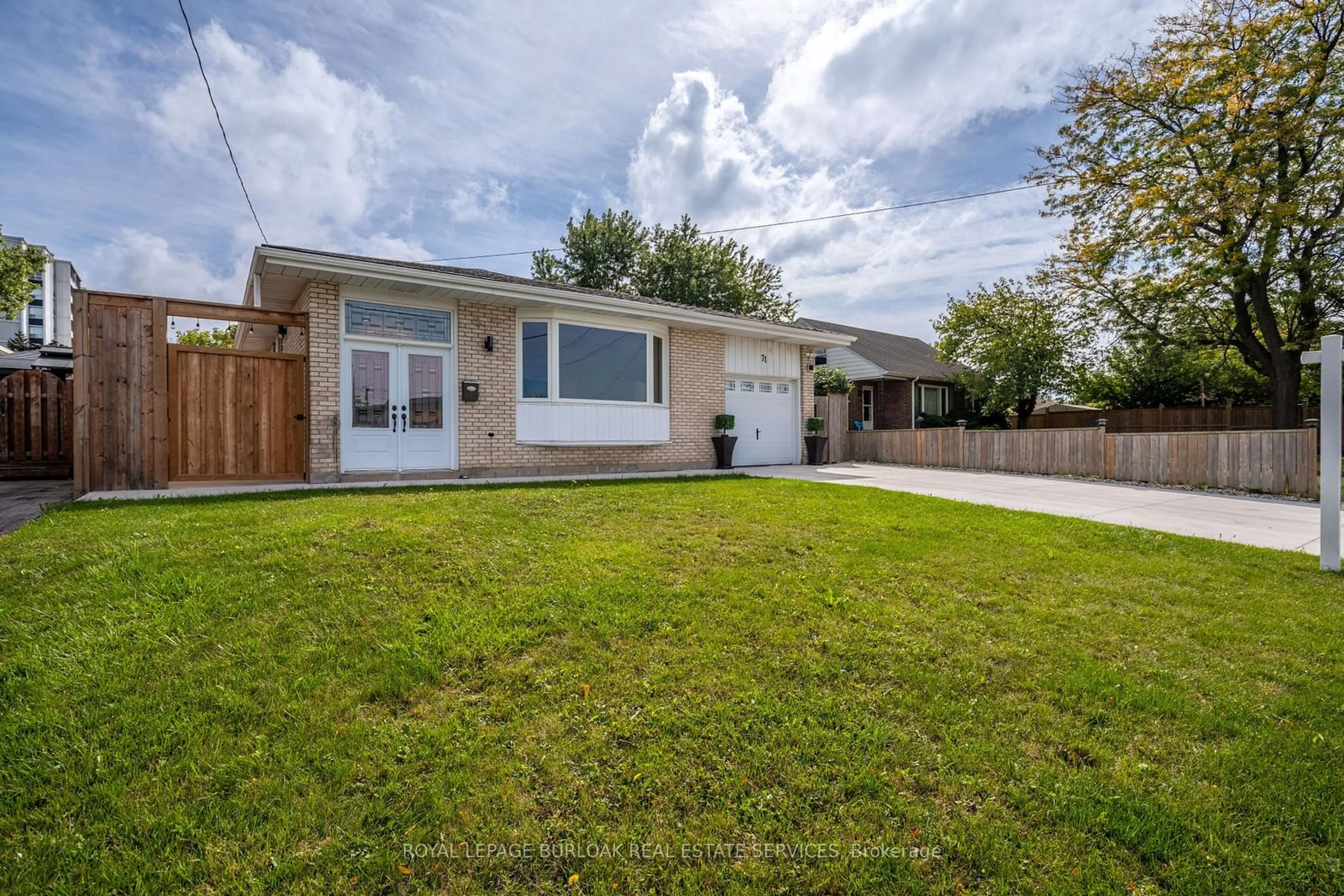 Frontside or backside of a home, the fenced backyard for 71 Fielding Cres, Hamilton Ontario L8V 2P3