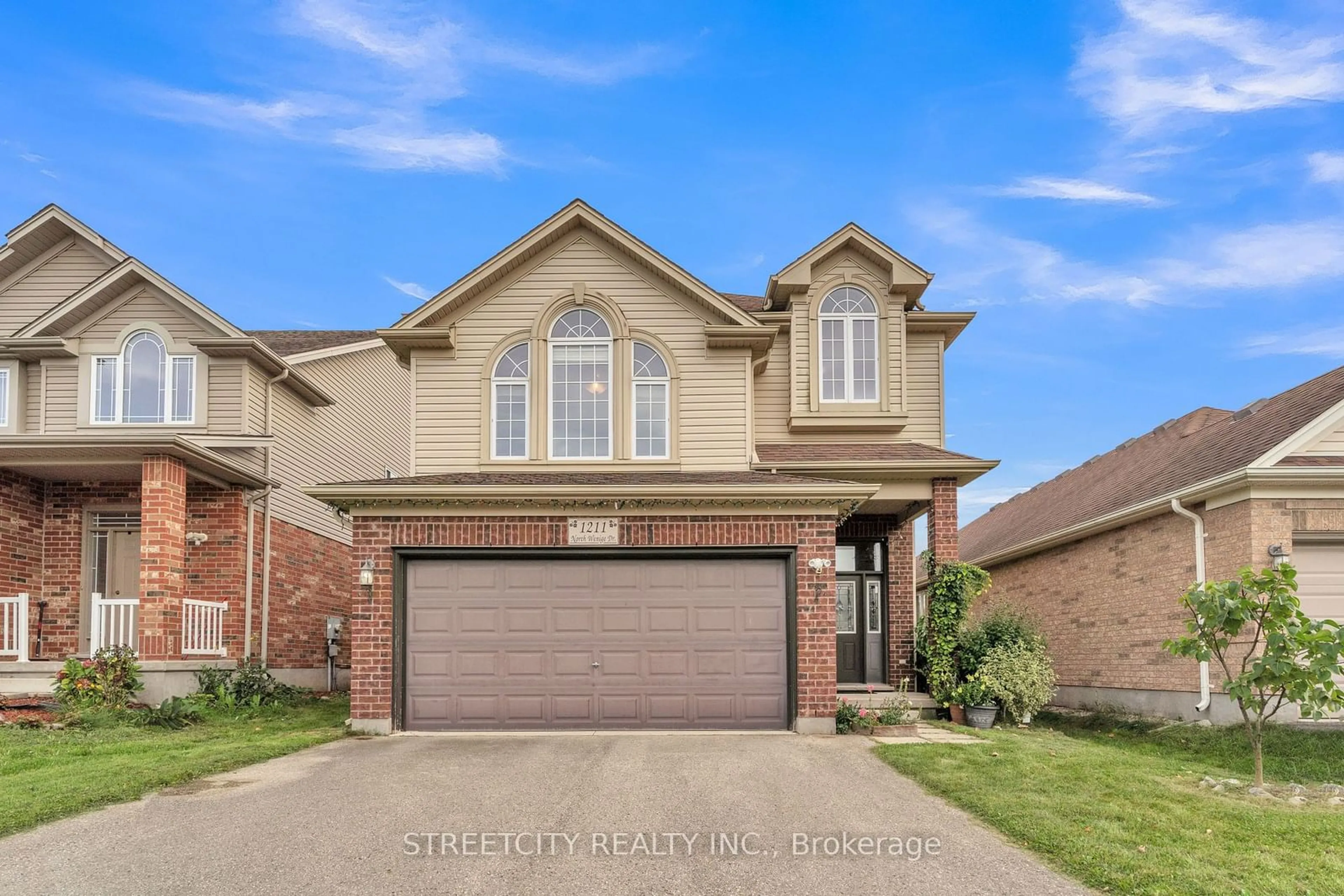 Frontside or backside of a home for 1211 North Wenige Dr, London Ontario N5X 4P7