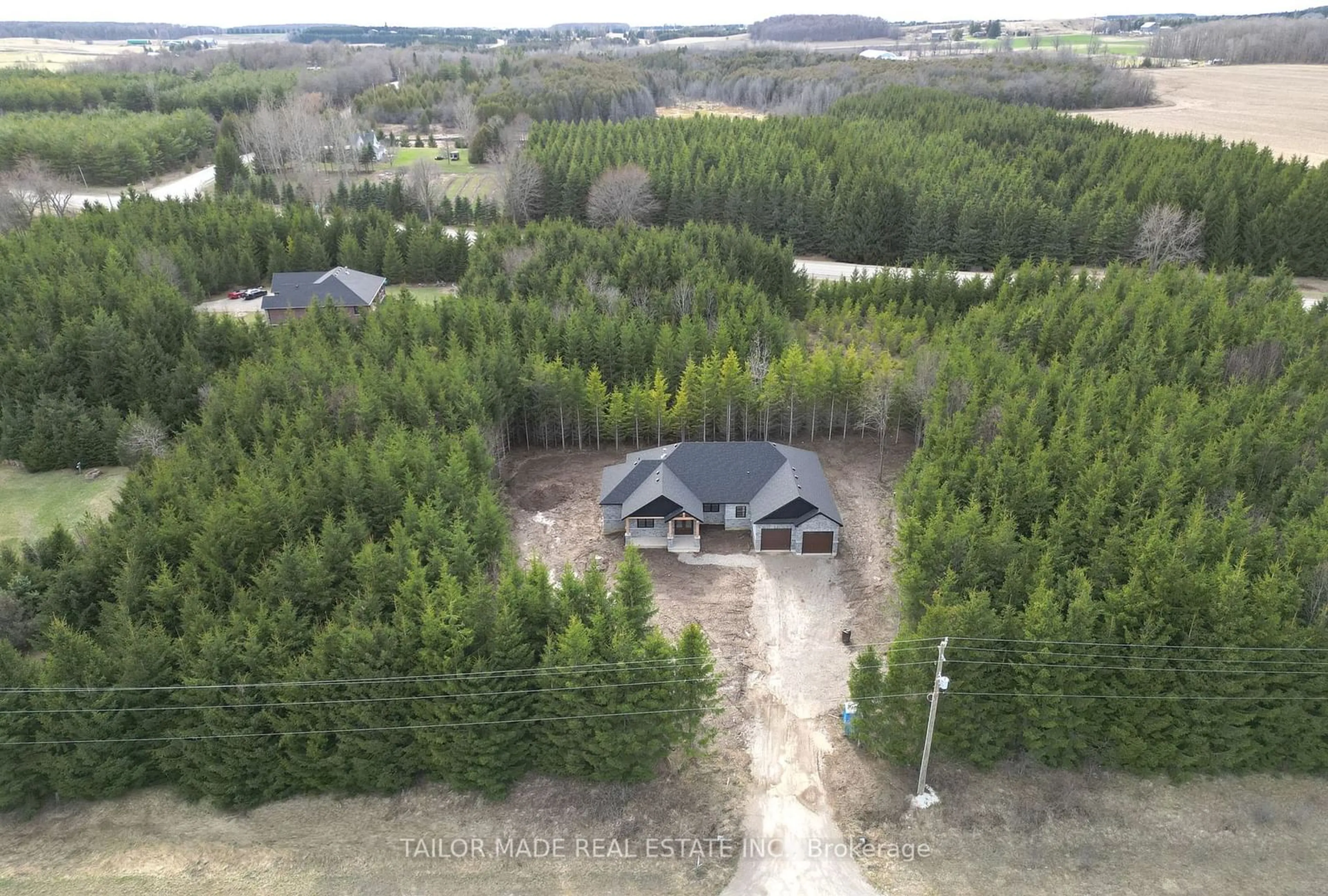 A pic from outside/outdoor area/front of a property/back of a property/a pic from drone, forest/trees view for 537266 Main St, Melancthon Ontario L0N 1J0