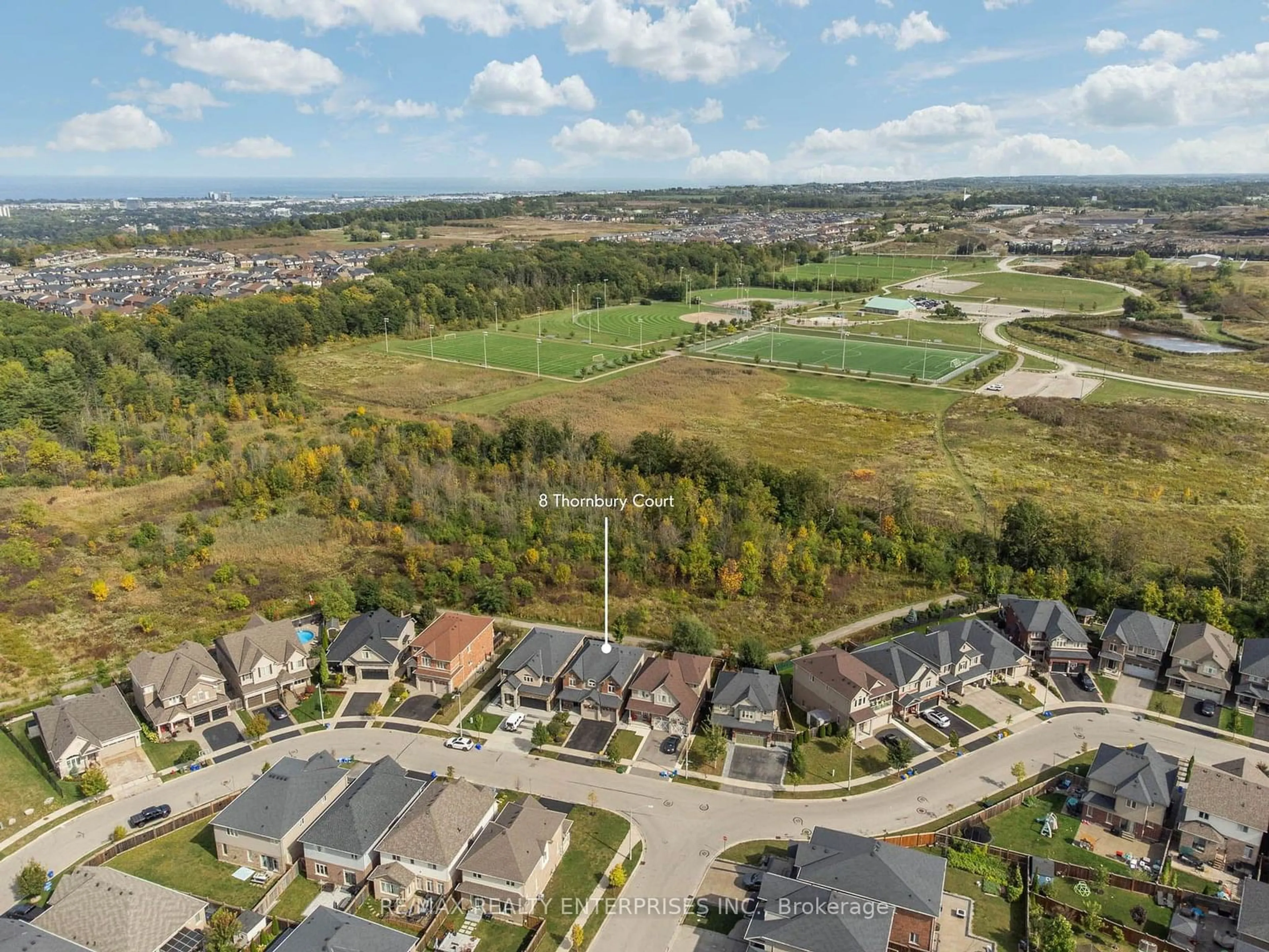 A pic from exterior of the house or condo, the fenced backyard for 8 Thornbury Crt, Hamilton Ontario L8J 0G7