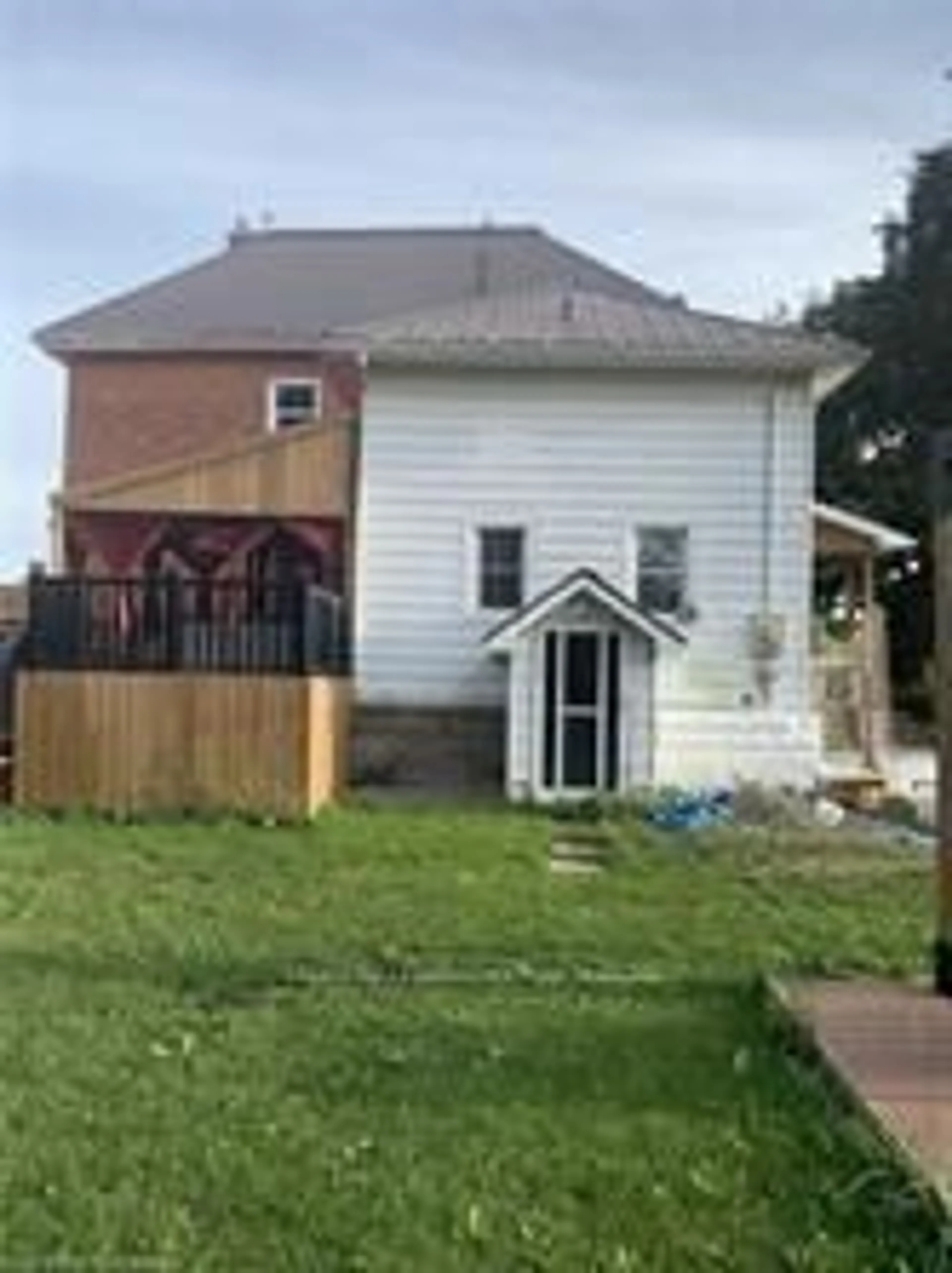 Frontside or backside of a home, the fenced backyard for 8 Talbot St, Haldimand Ontario N0A 1E0