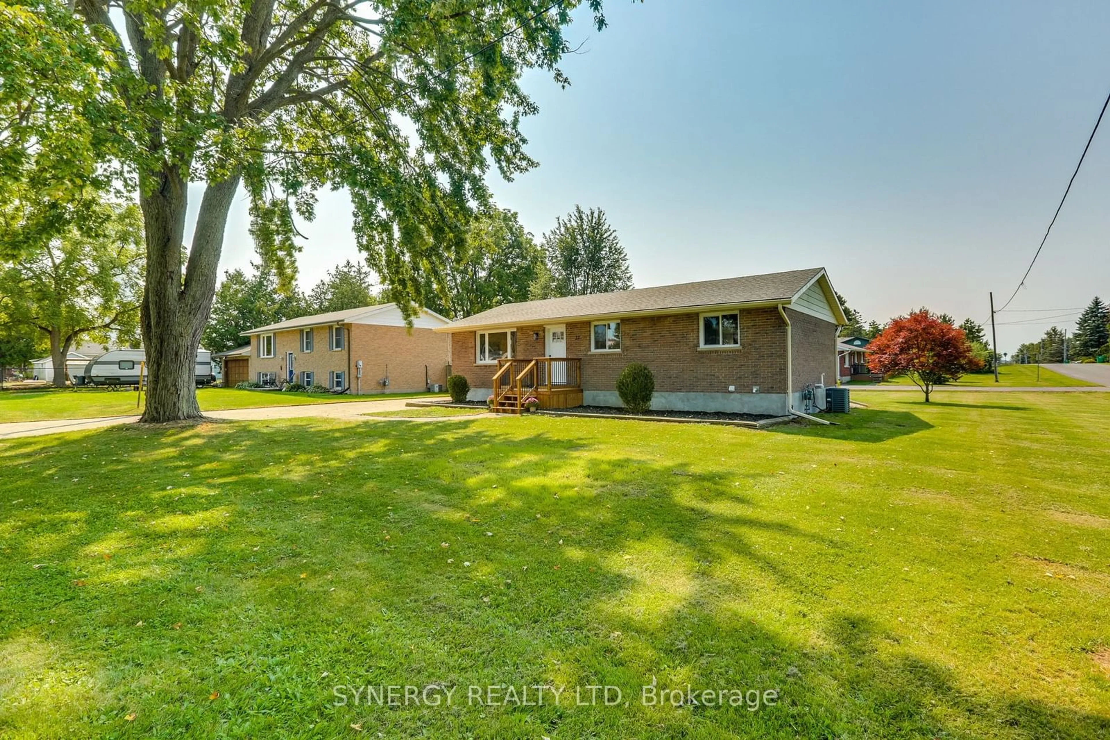 Frontside or backside of a home, the fenced backyard for 32 Clark St, Strathroy-Caradoc Ontario N0L 1T0