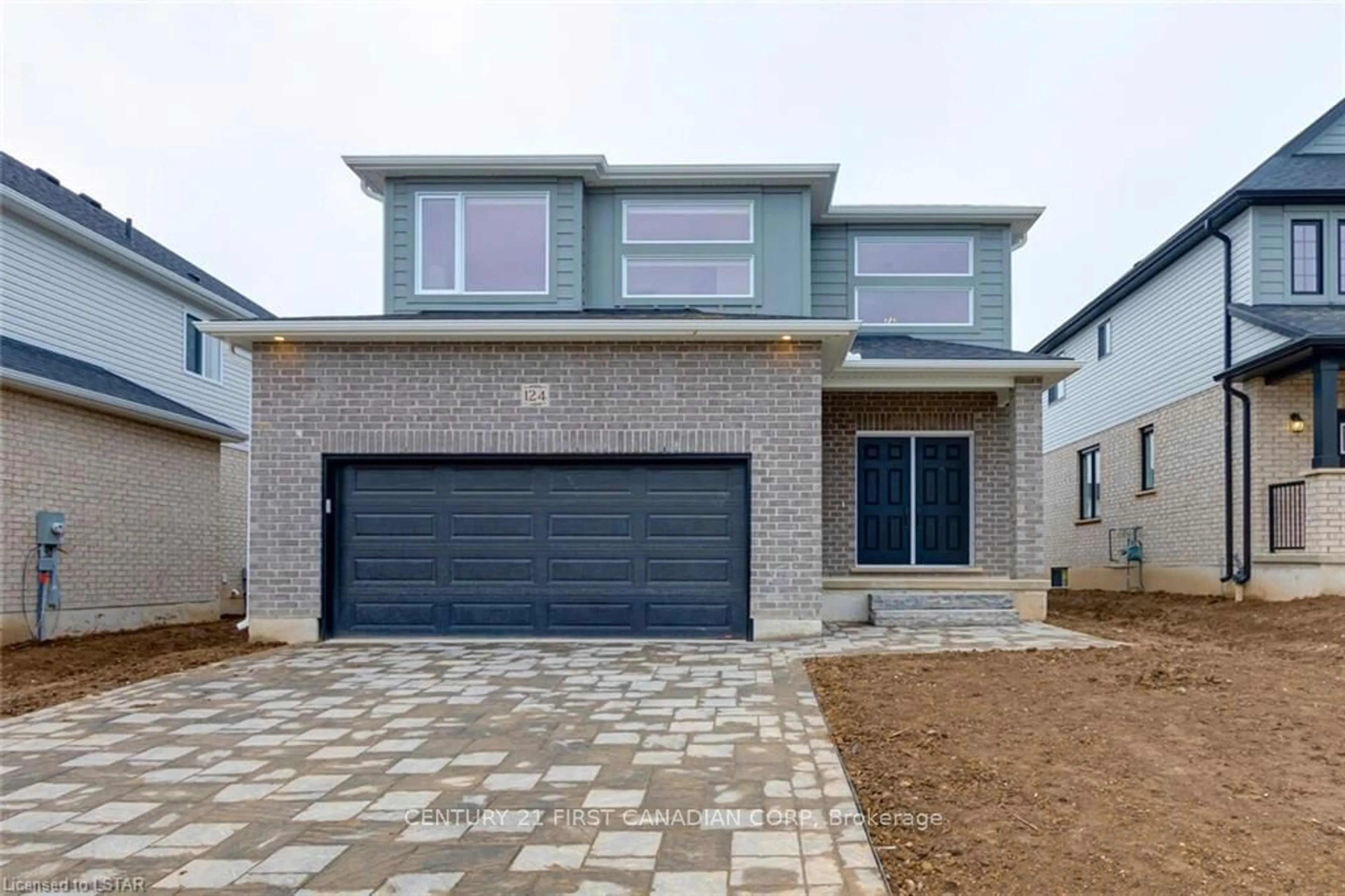 Home with brick exterior material for 124 Basil Cres, Middlesex Centre Ontario N0M 2A0