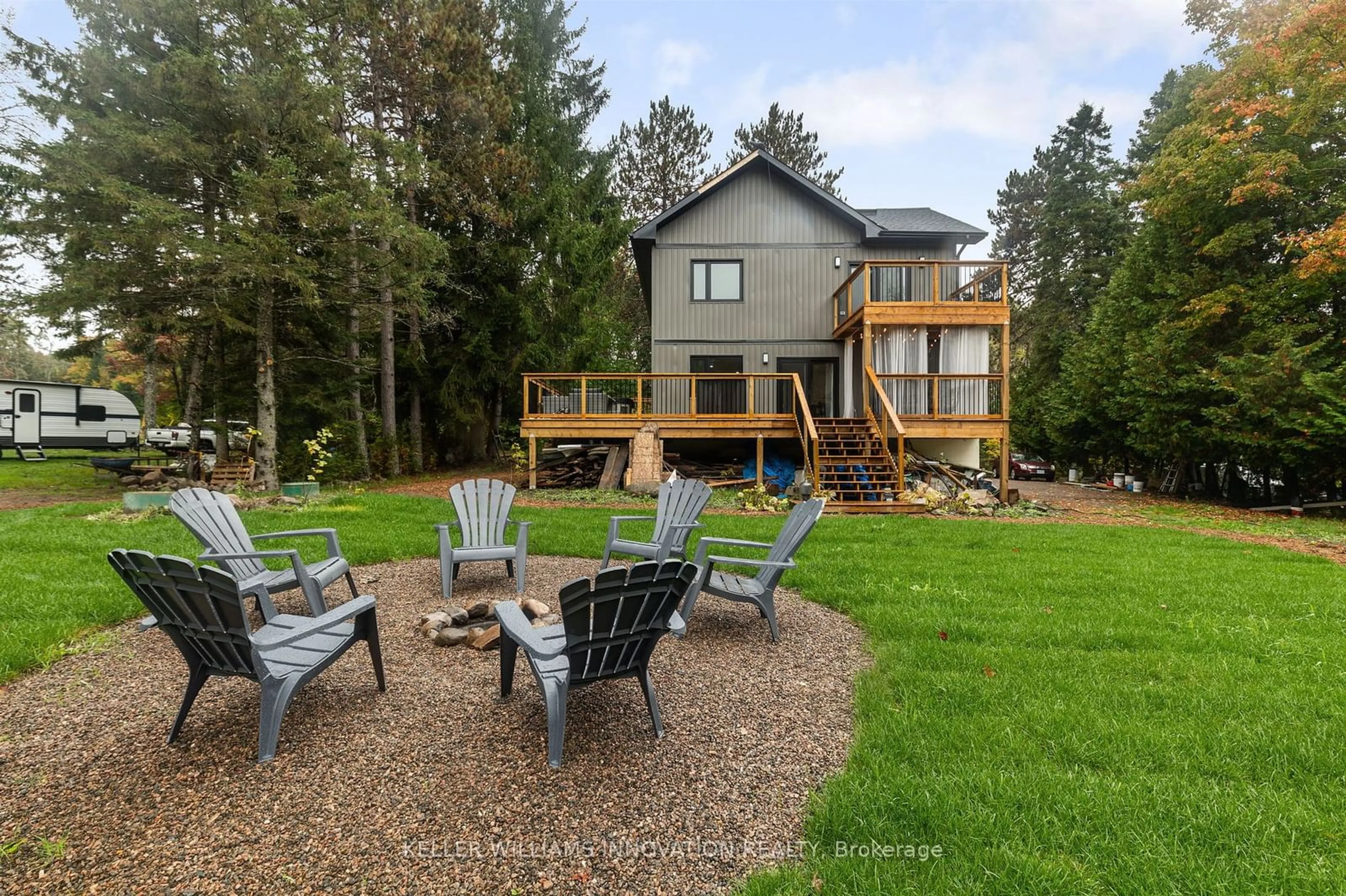 Frontside or backside of a home, the fenced backyard for 127 Paradise Rd, South Algonquin Ontario K0J 2M0