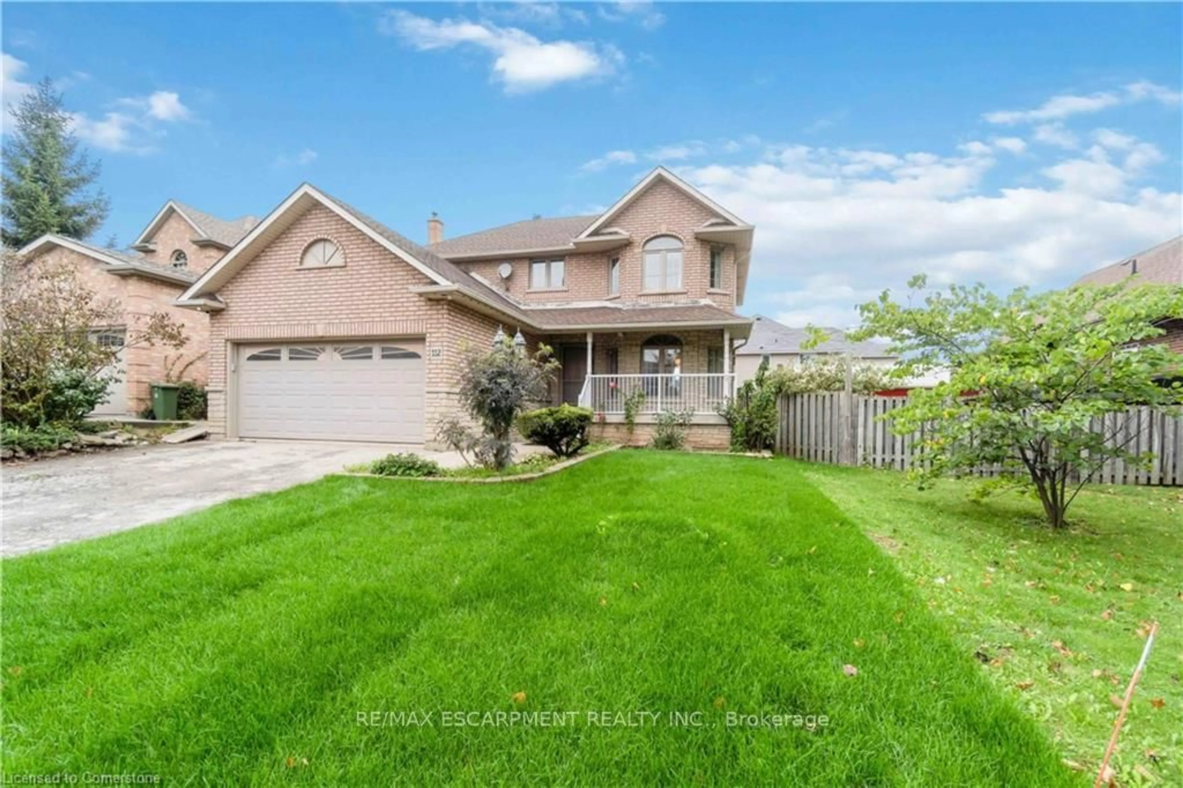 Frontside or backside of a home, the fenced backyard for 112 Stone Church Rd, Hamilton Ontario L9B 1A3