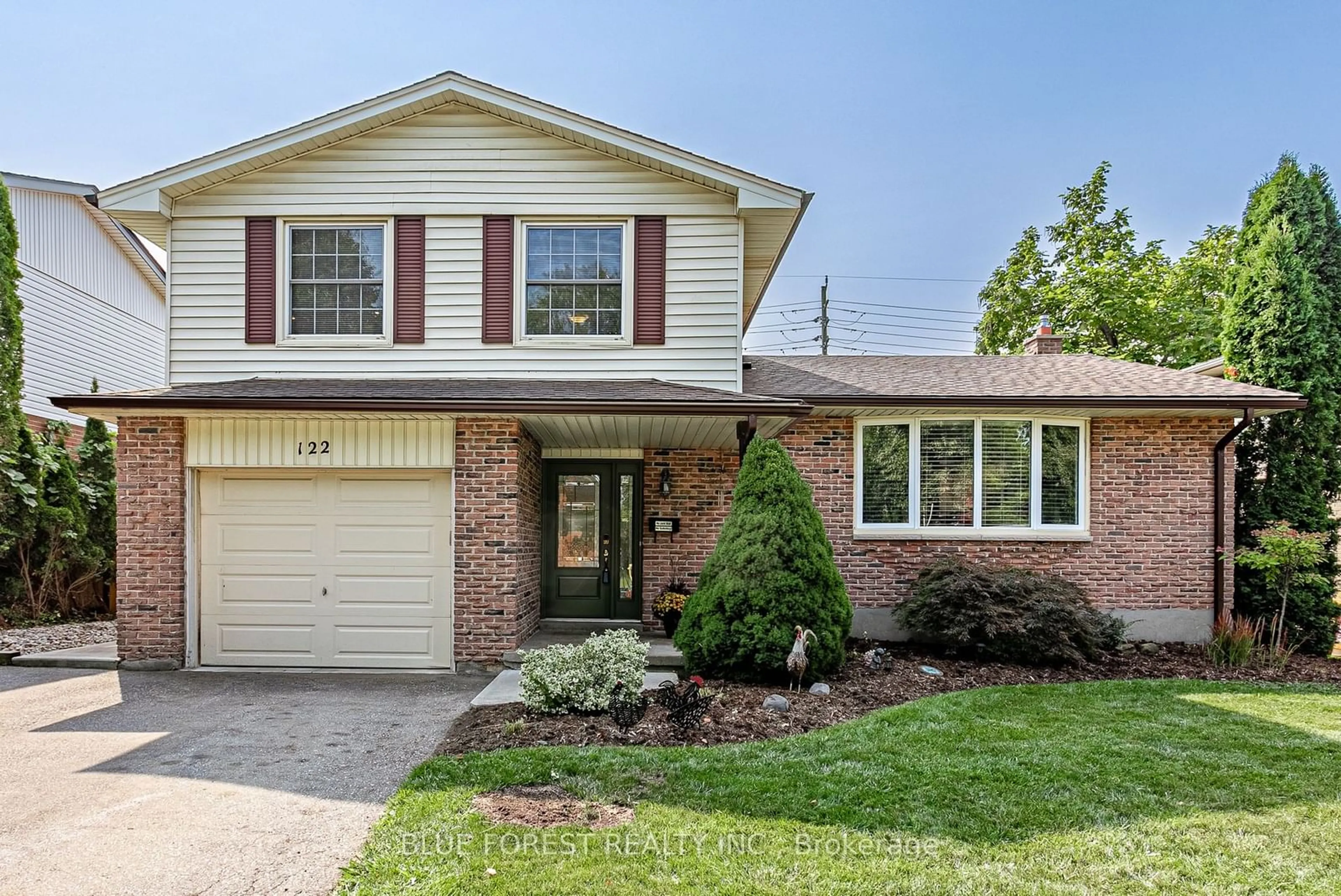 Home with brick exterior material for 122 St. Clair Cres, London Ontario N6J 3V9