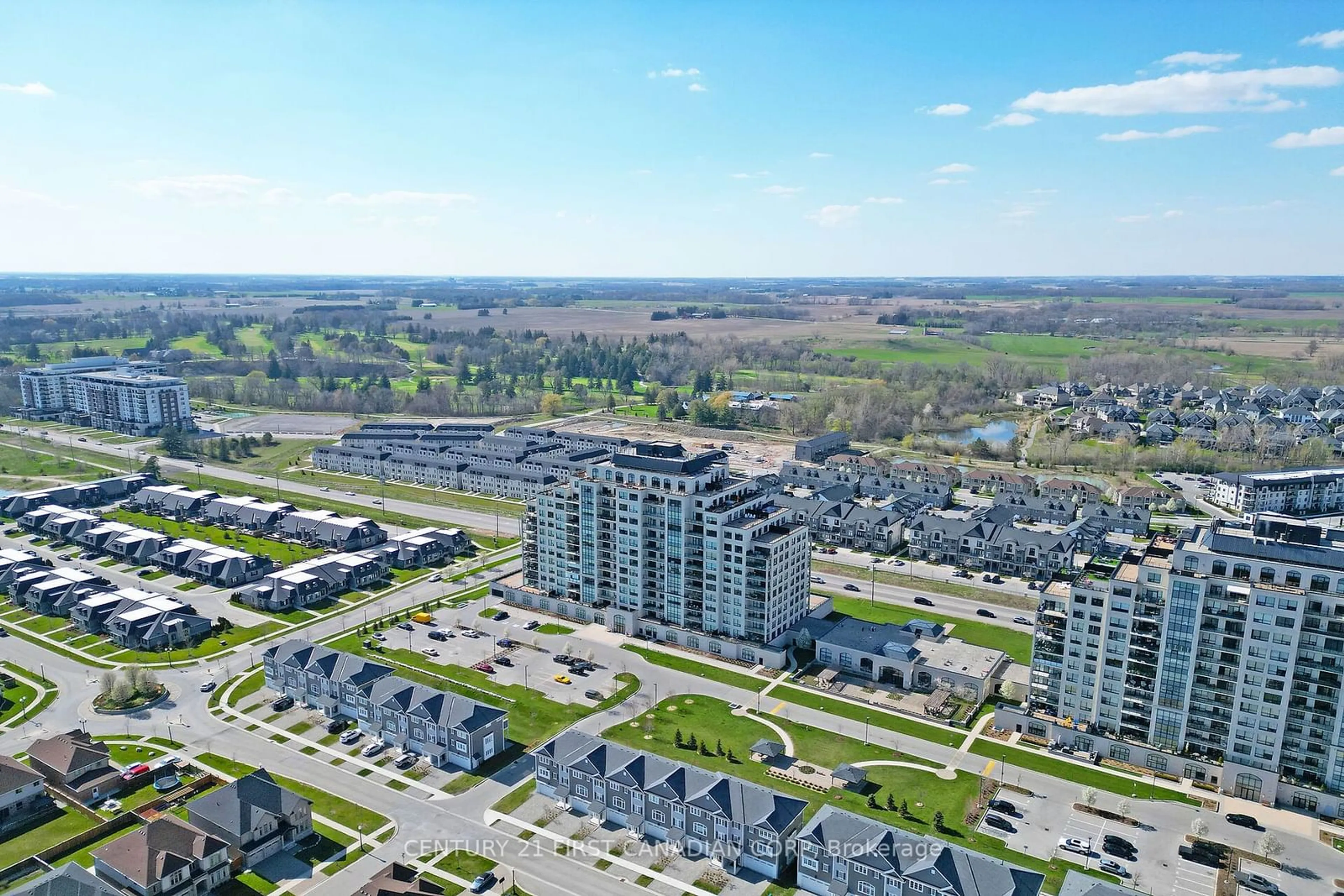 A pic from exterior of the house or condo, the view of city buildings for 260 Villagewalk Blvd #206, London Ontario N6G 0W6