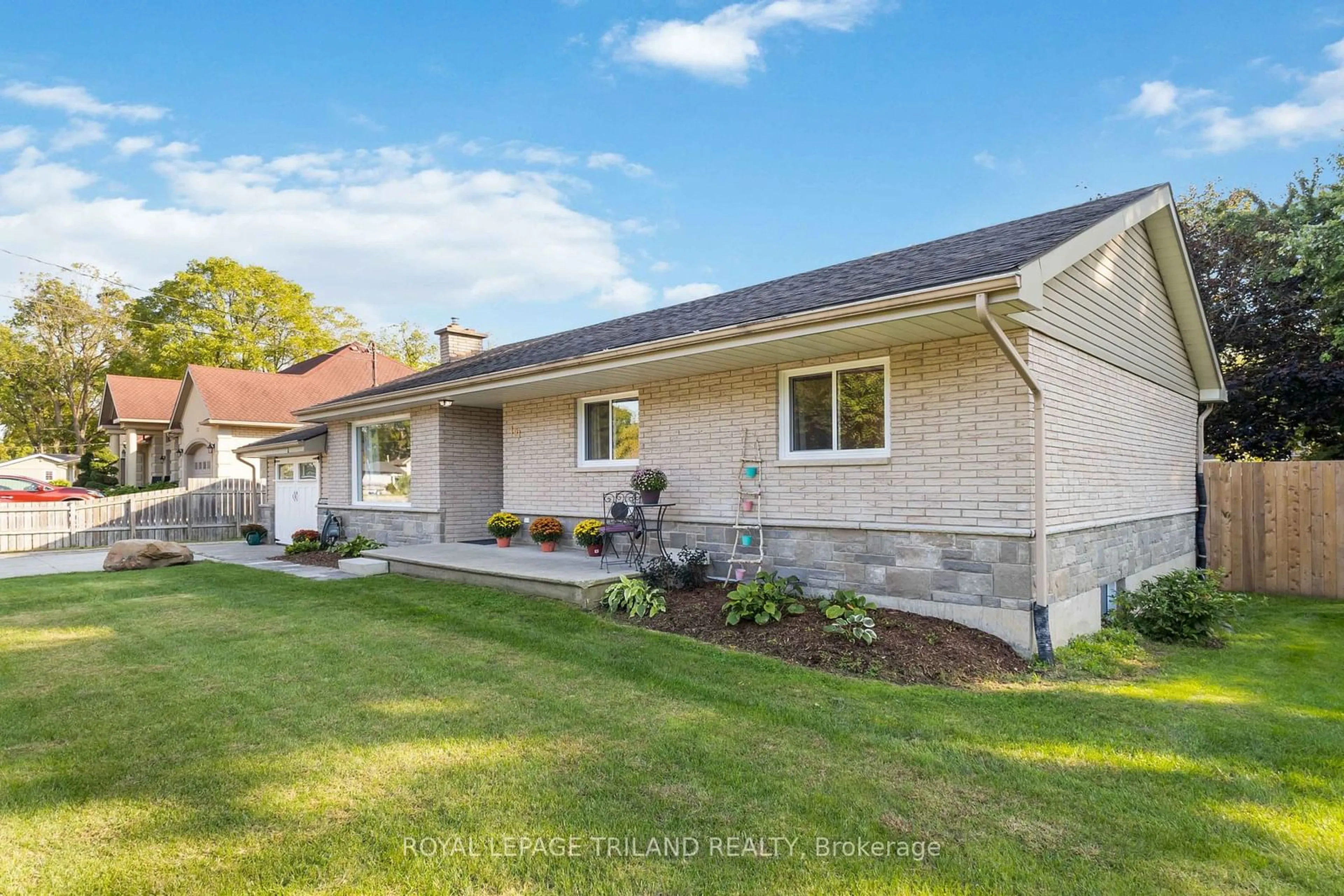 Frontside or backside of a home, the fenced backyard for 191 Bethany St, North Middlesex Ontario N0M 2K0