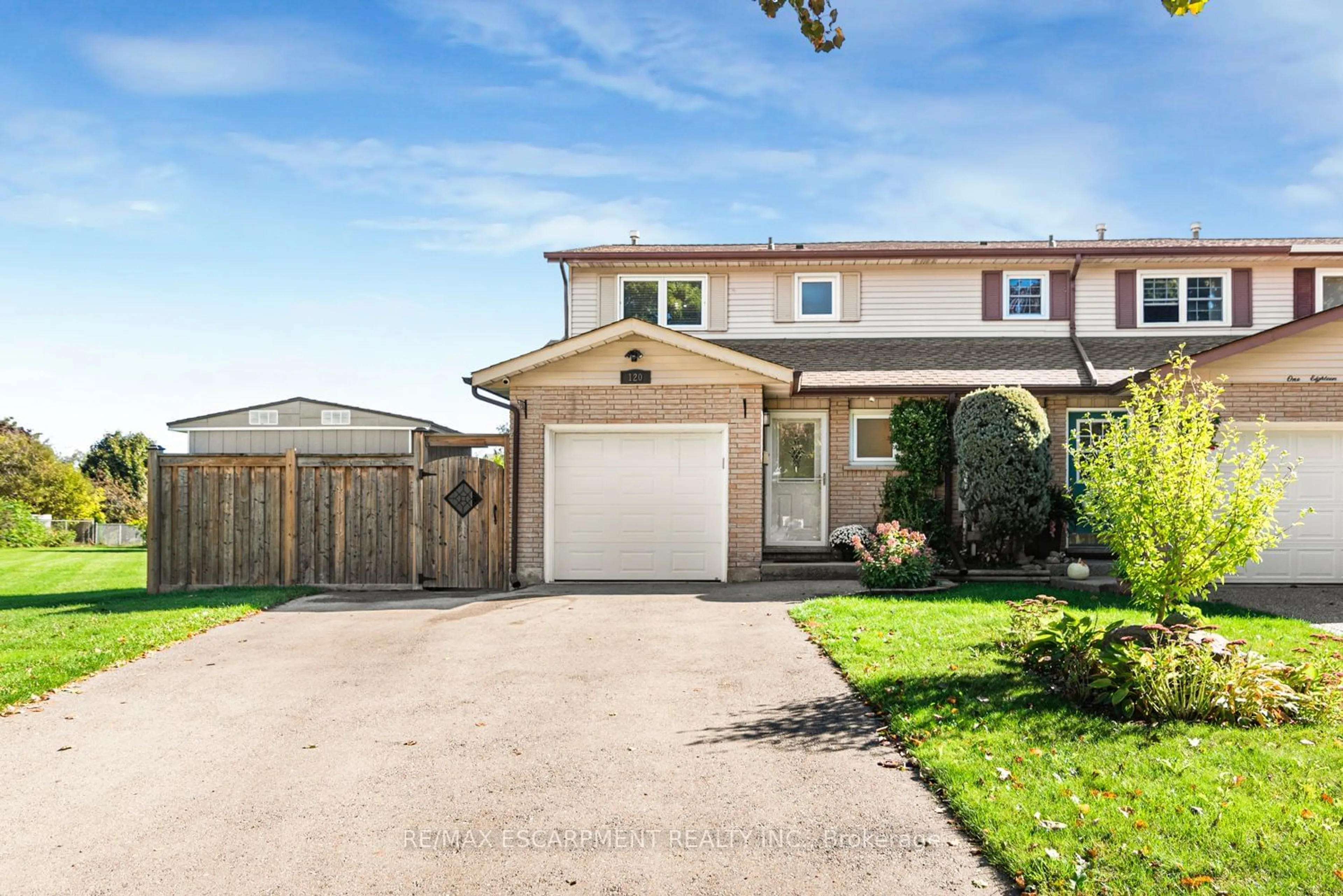 Frontside or backside of a home, the fenced backyard for 120 Aylmer Cres, Hamilton Ontario L8J 1K3