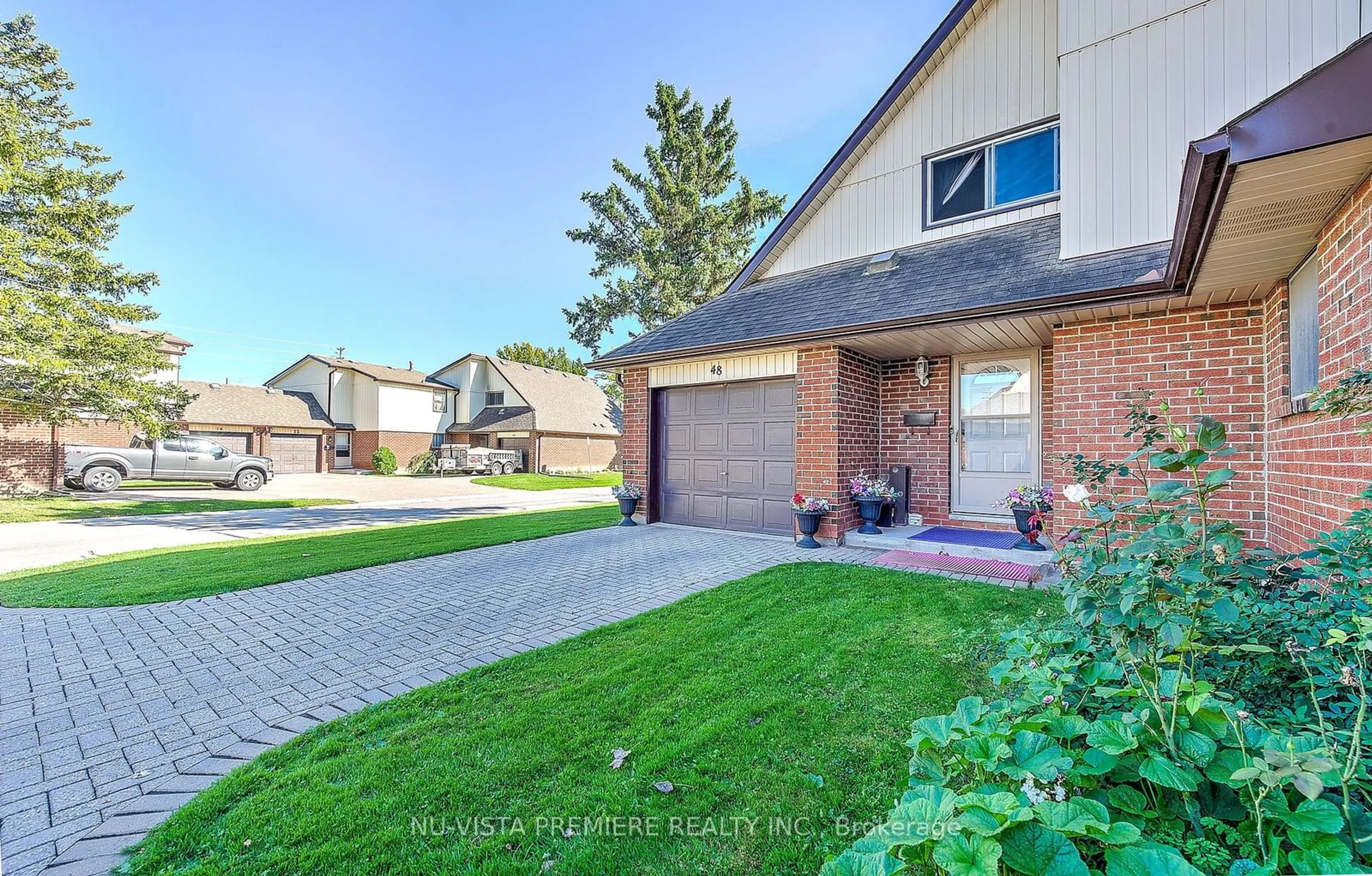 Home with brick exterior material for 971 Adelaide St #48, London Ontario N6E 2H3