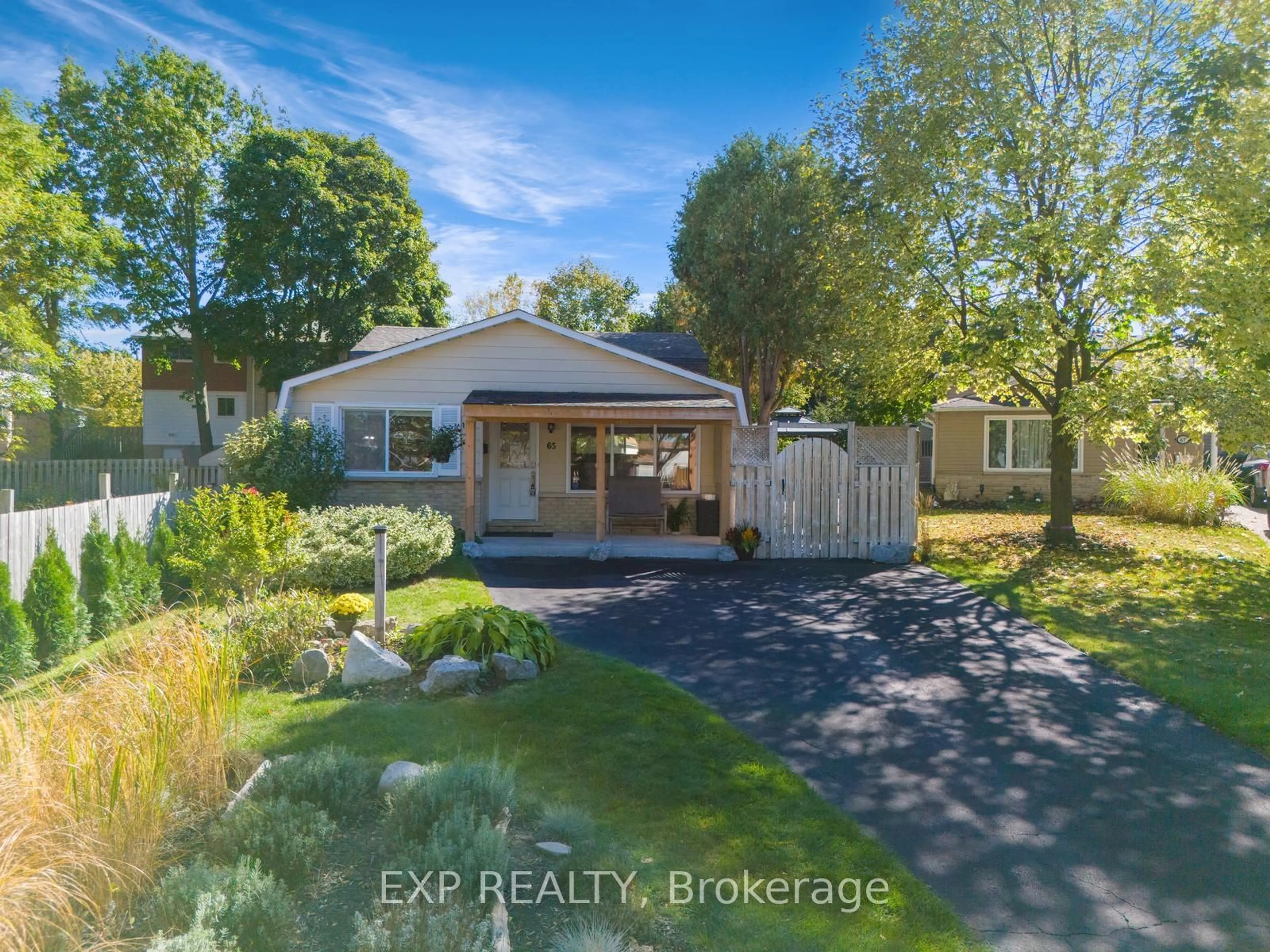 Frontside or backside of a home, the fenced backyard for 65 BRENDAWOOD Cres, Waterloo Ontario N2J 4J5