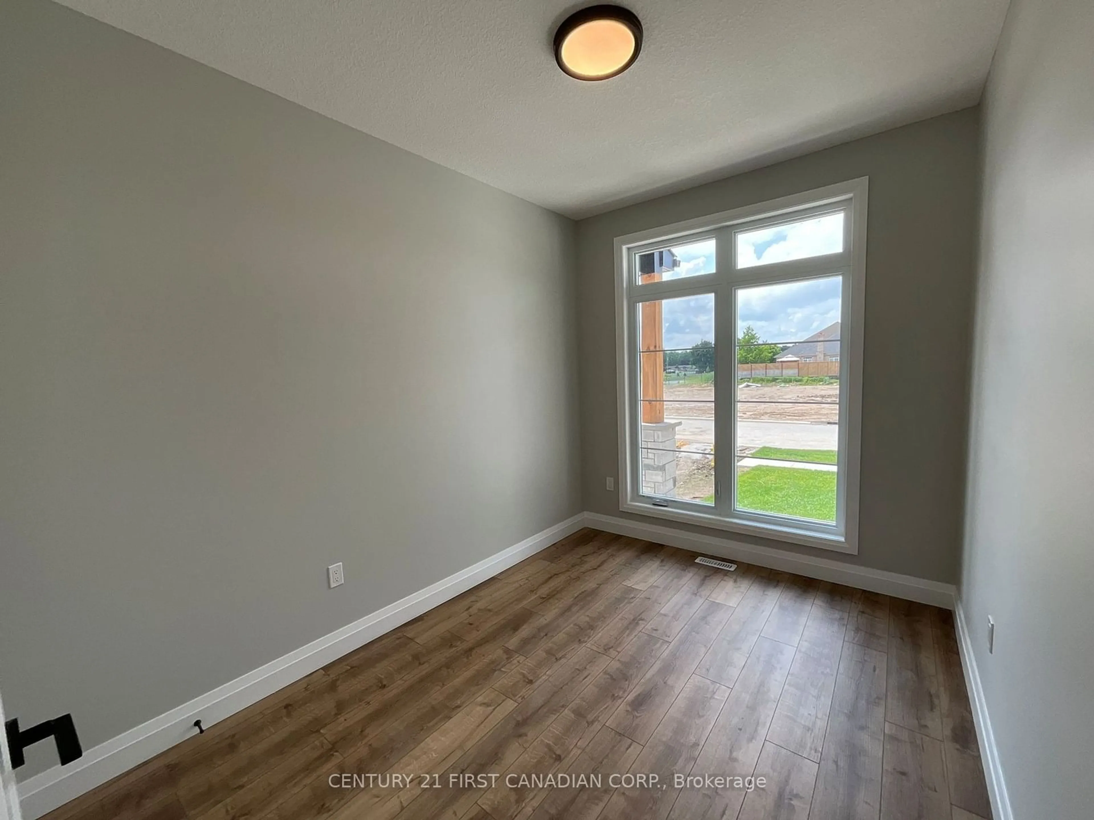 A pic of a room, wood floors for 54 POSTMA Cres, North Middlesex Ontario N0M 1A0