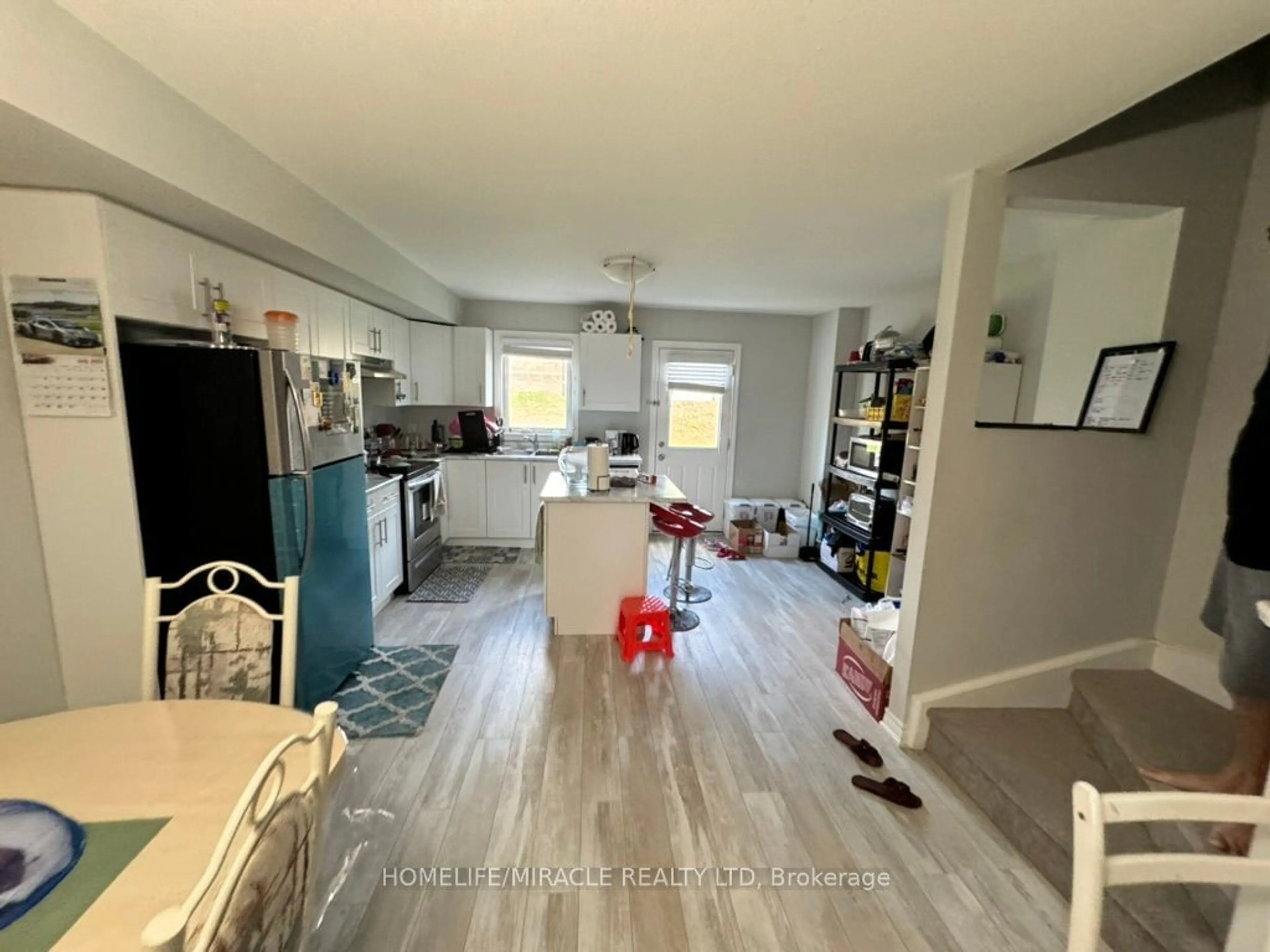 A pic of a room, wood floors for 7768 ASCOT Circ #64, Niagara Falls Ontario L2H 3P9