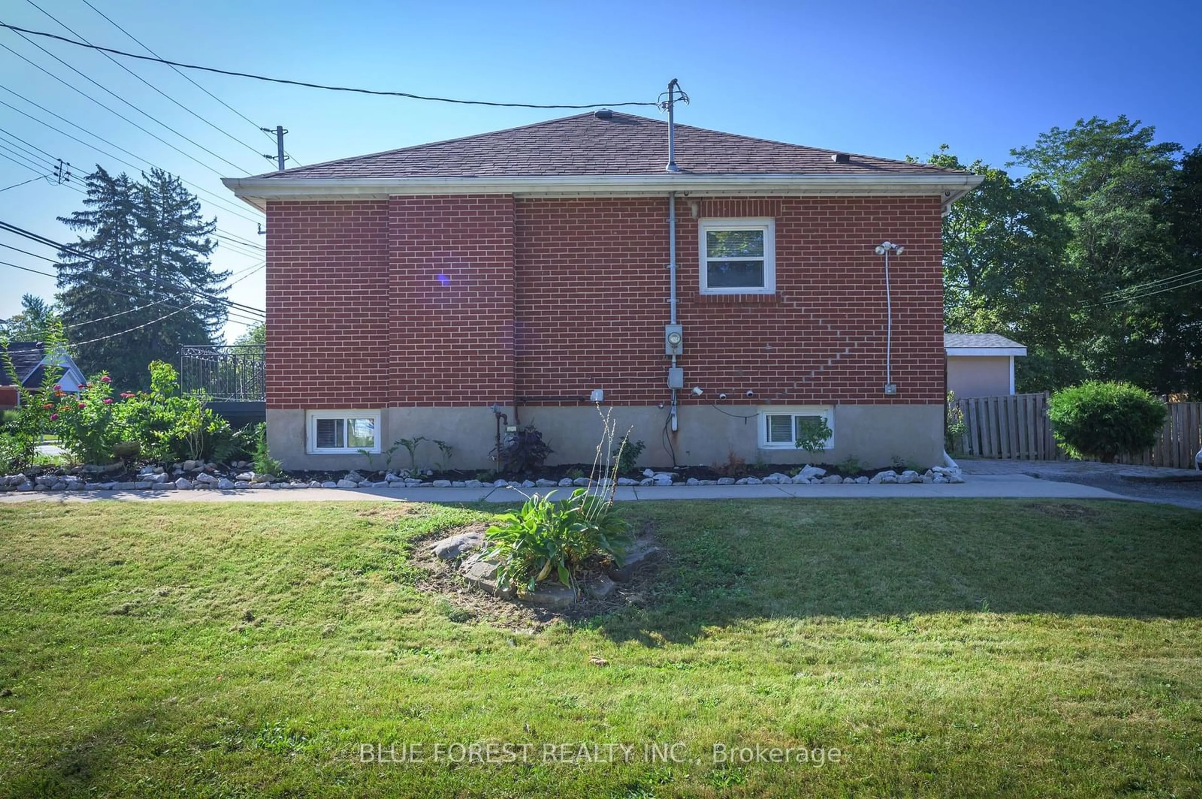 Frontside or backside of a home, the fenced backyard for 899 Adelaide St, London Ontario N5Y 2M4