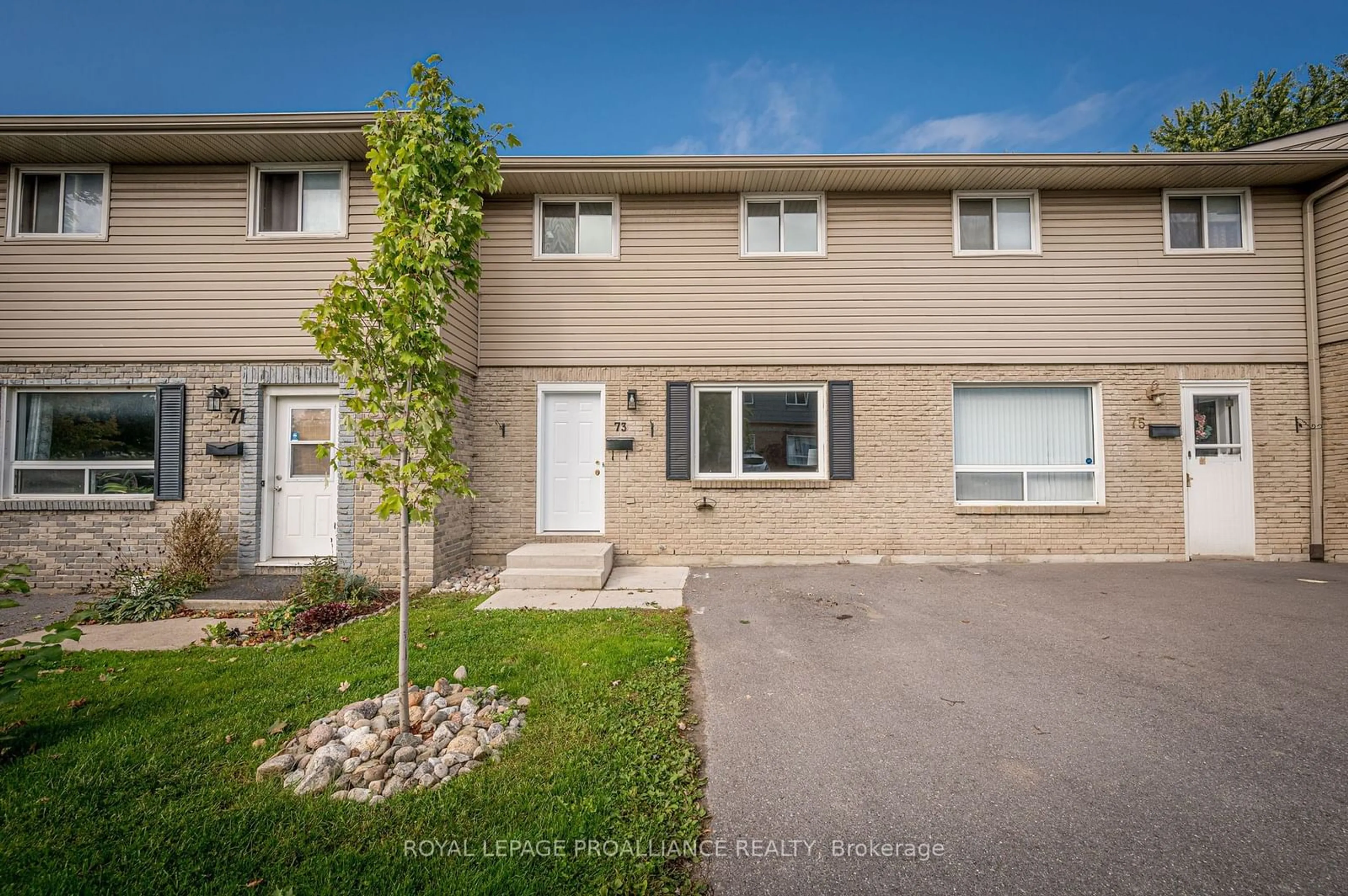 A pic from exterior of the house or condo, the fenced backyard for 73 Rosemund Cres #127, Kingston Ontario K7M 6Y9