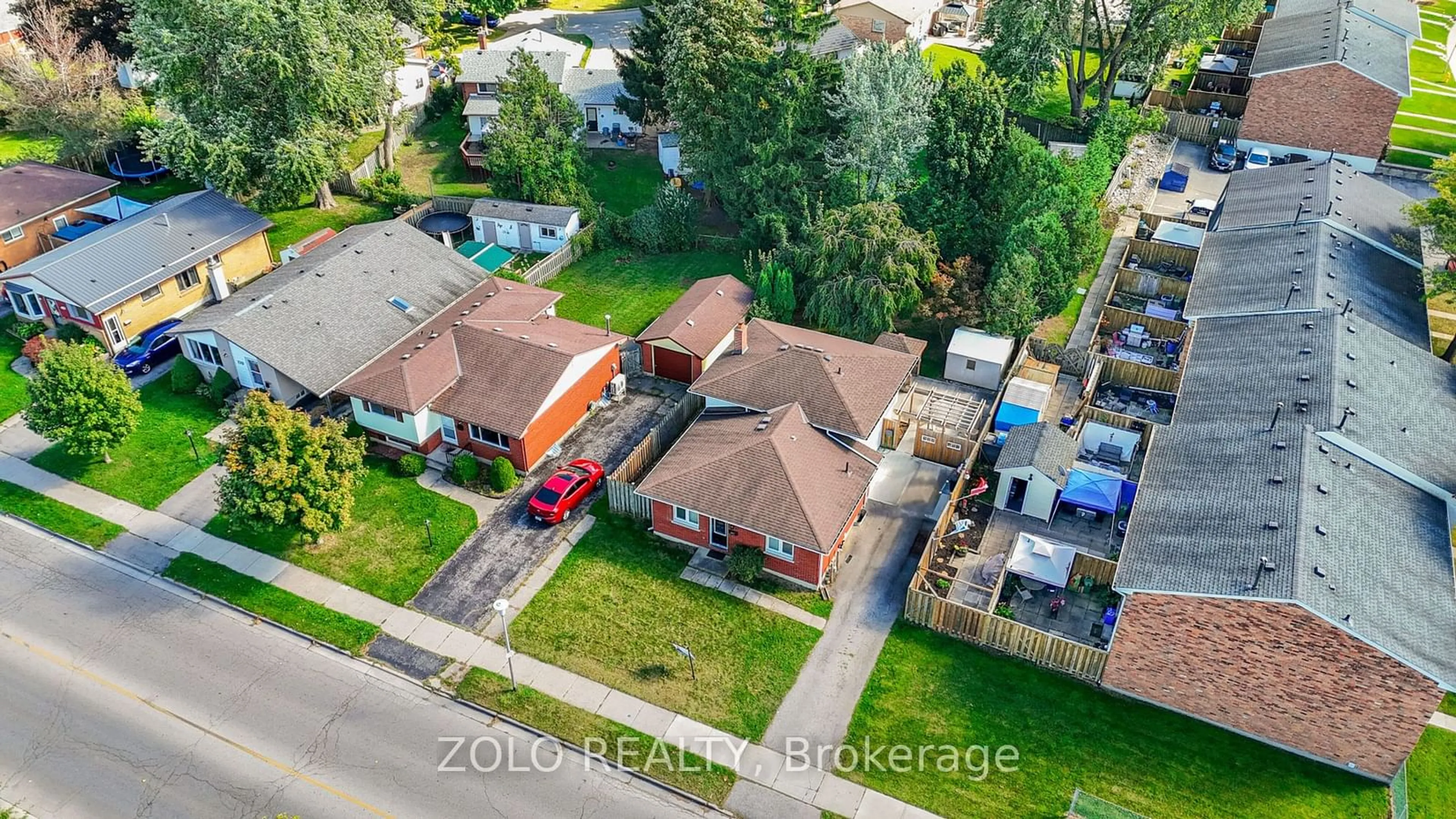 Frontside or backside of a home, the fenced backyard for 221 Admiral Dr, London Ontario N5V 1H9