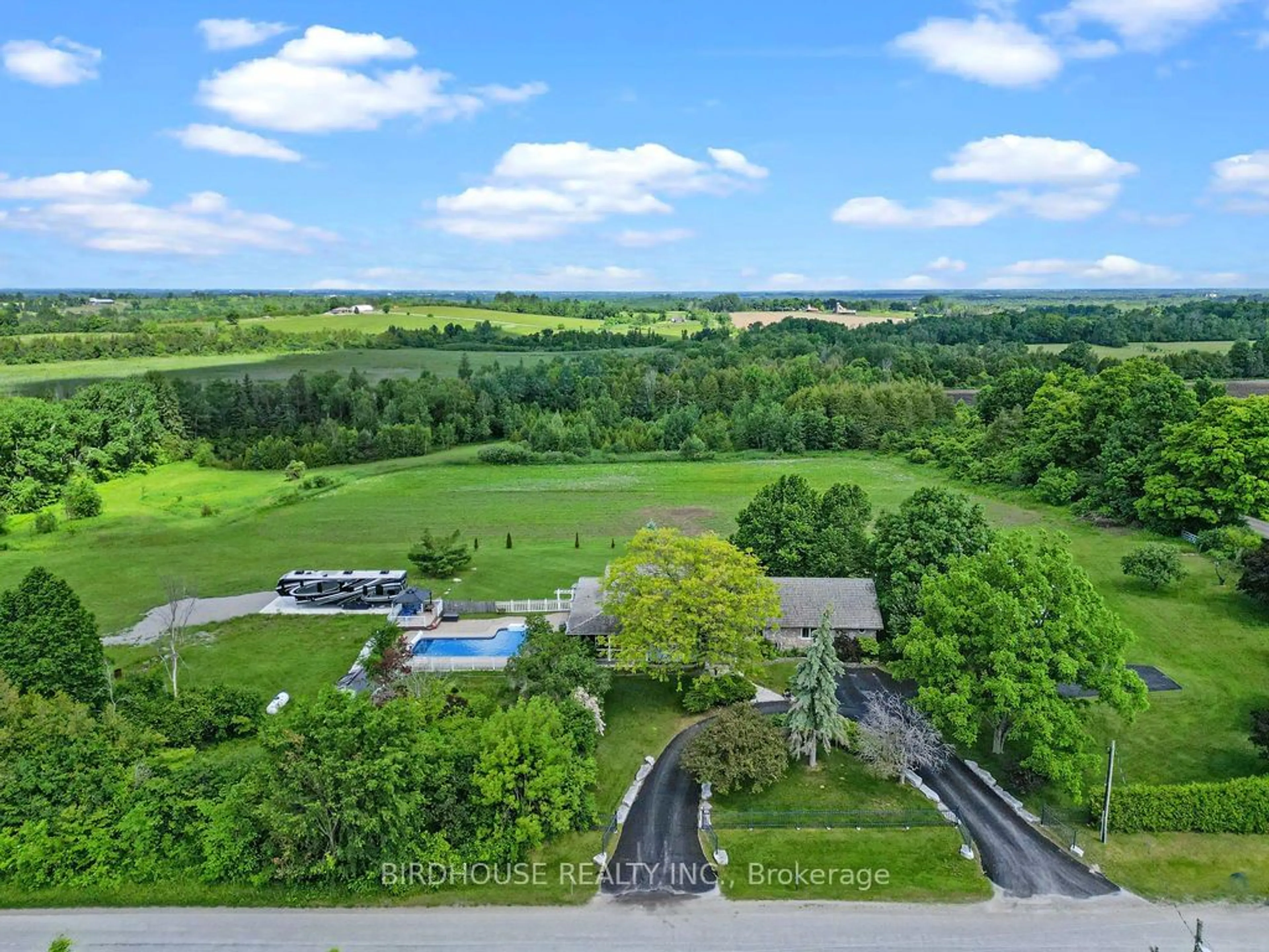 A pic from exterior of the house or condo, the fenced backyard for 593 Pigeon Creek Rd, Kawartha Lakes Ontario L0B 1K0