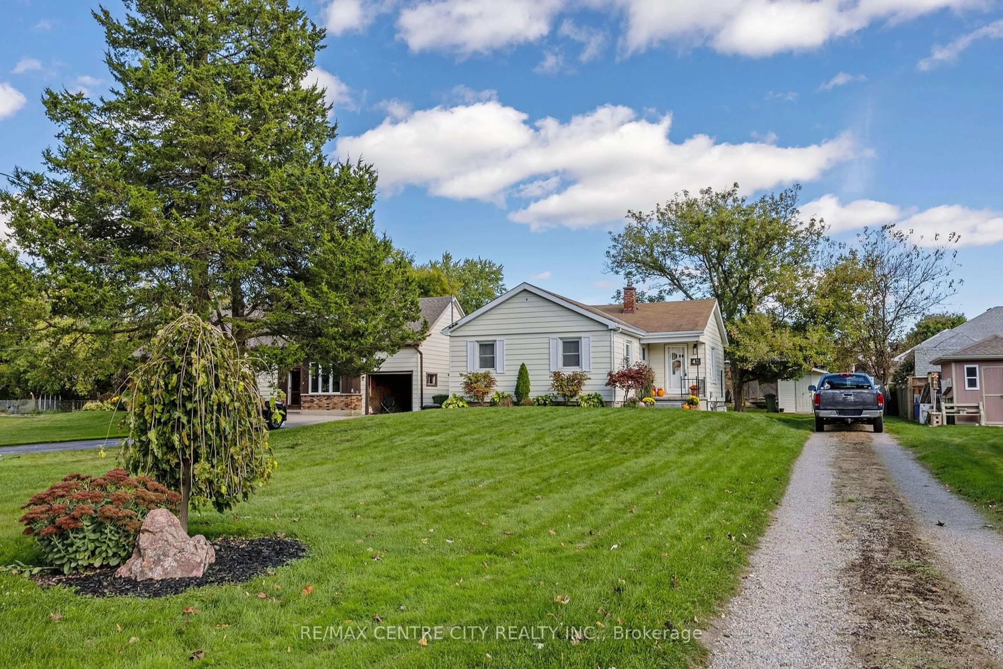 Frontside or backside of a home, the fenced backyard for 47 Park Ave, St. Thomas Ontario N5R 4V9