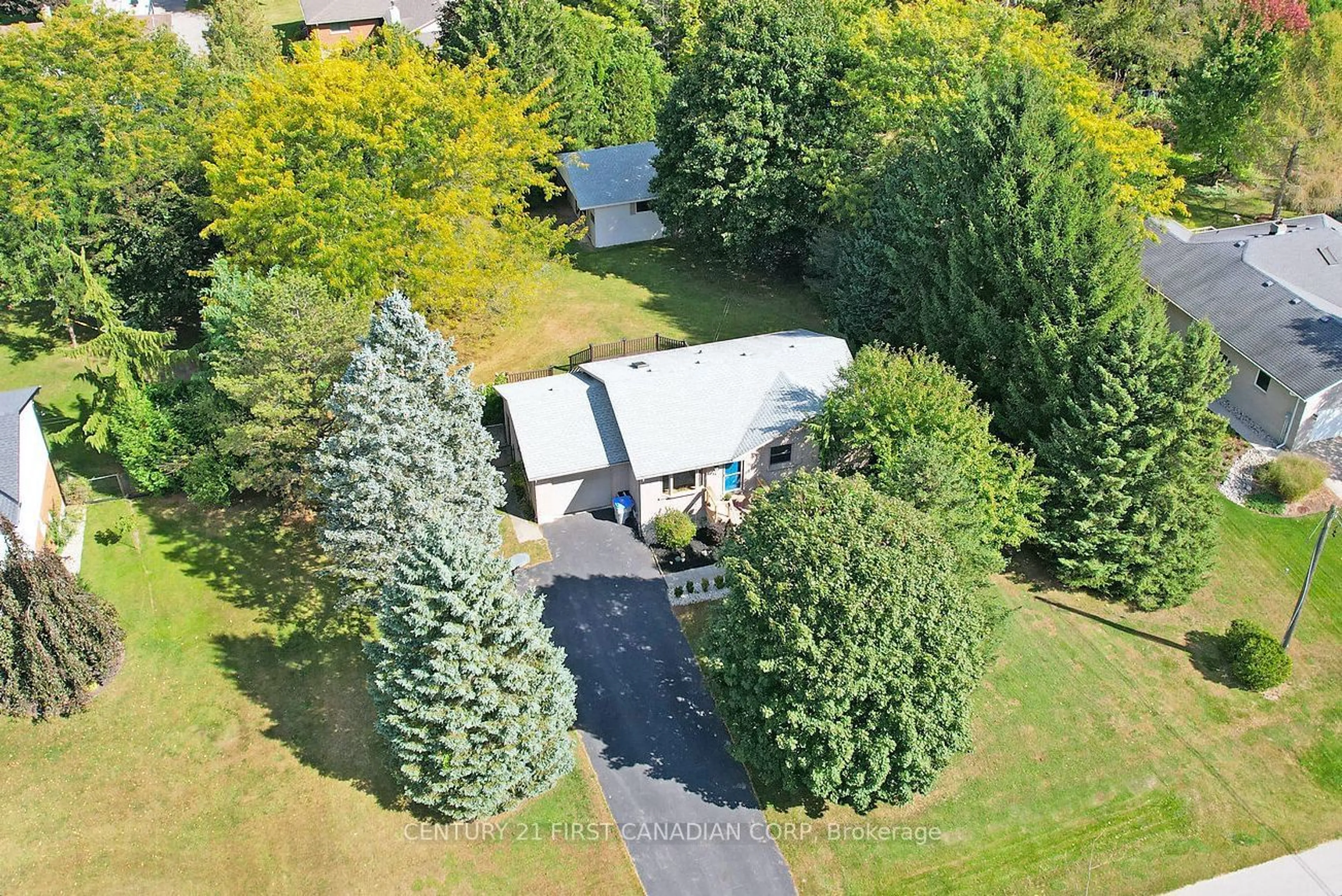 Frontside or backside of a home, the fenced backyard for 14 Mckay St, Middlesex Centre Ontario N0M 2A0