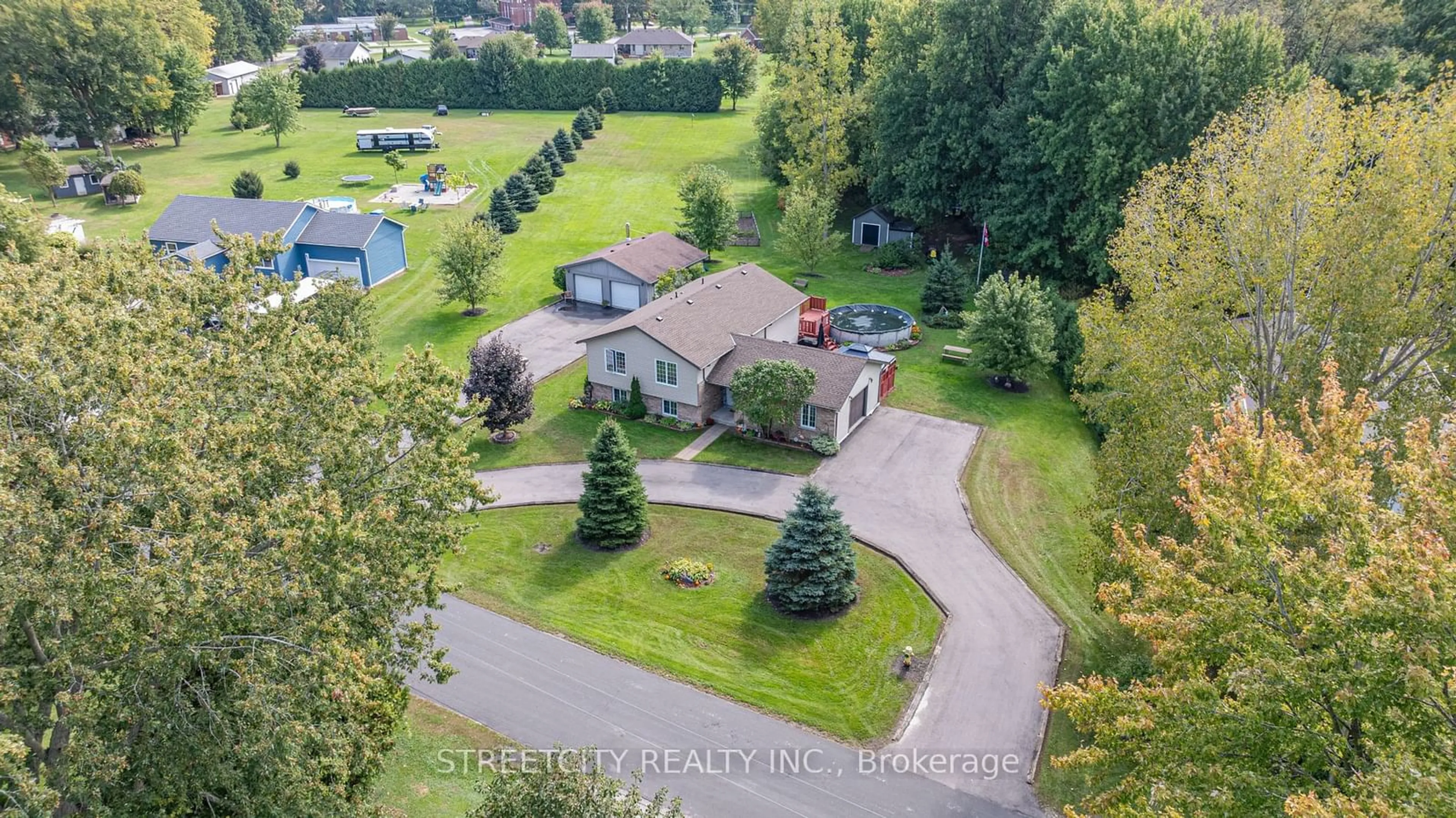 Frontside or backside of a home, the fenced backyard for 35 Adams St, Norfolk Ontario N0J 1E0