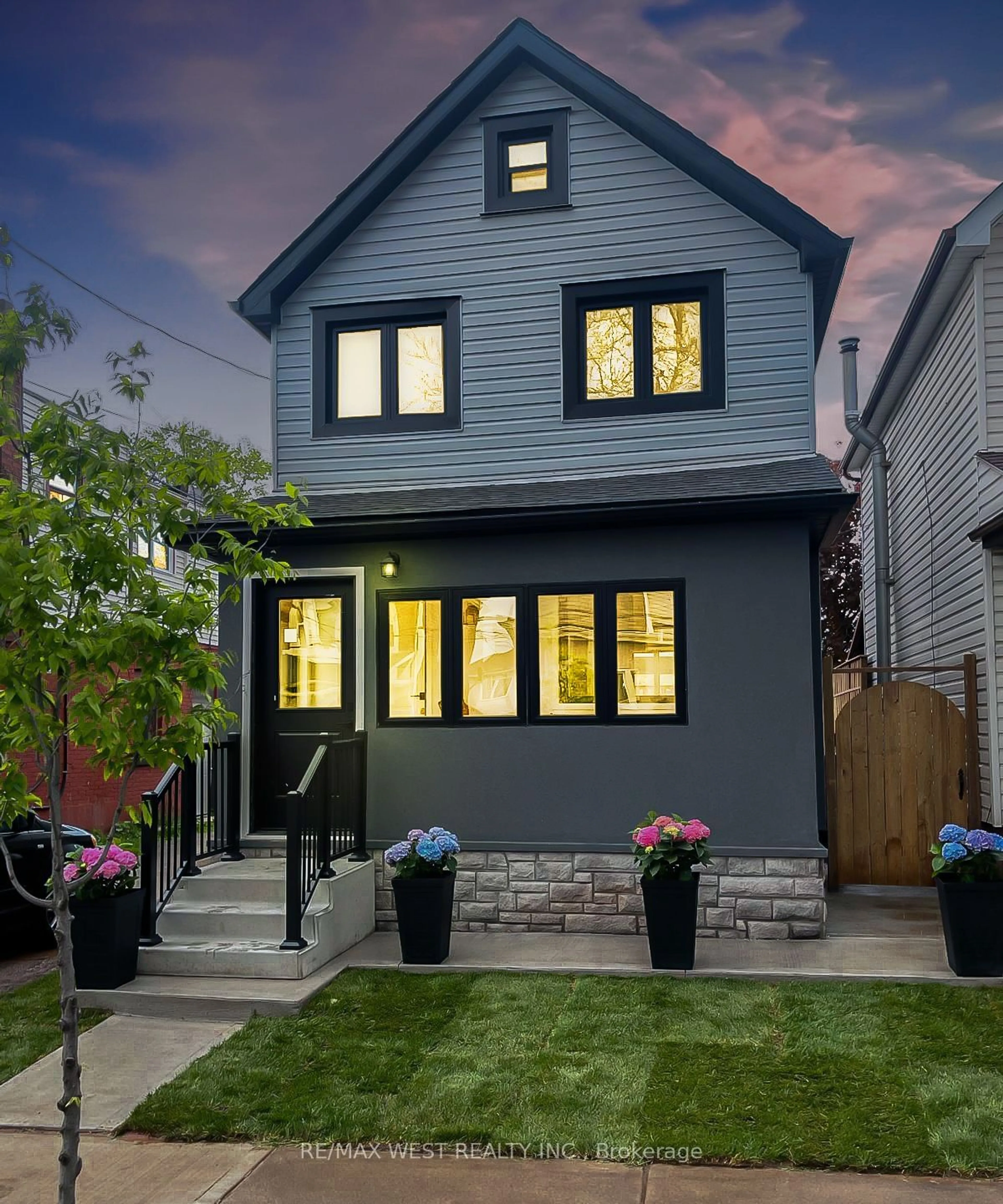 Frontside or backside of a home, the fenced backyard for 110 Avondale St, Hamilton Ontario L8L 7B8