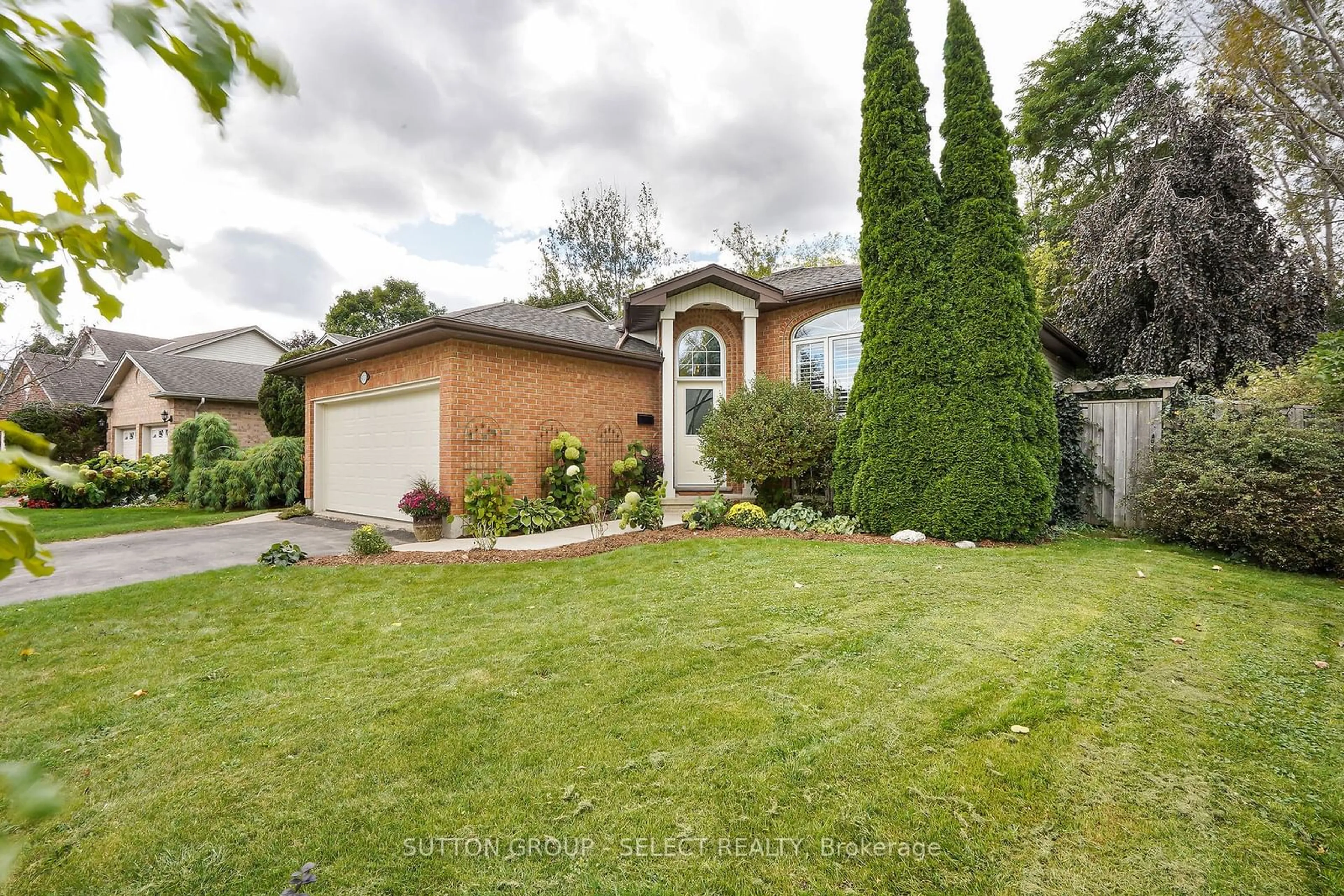 Frontside or backside of a home, the fenced backyard for 655 Thornwood Crt, London Ontario N6H 5J5