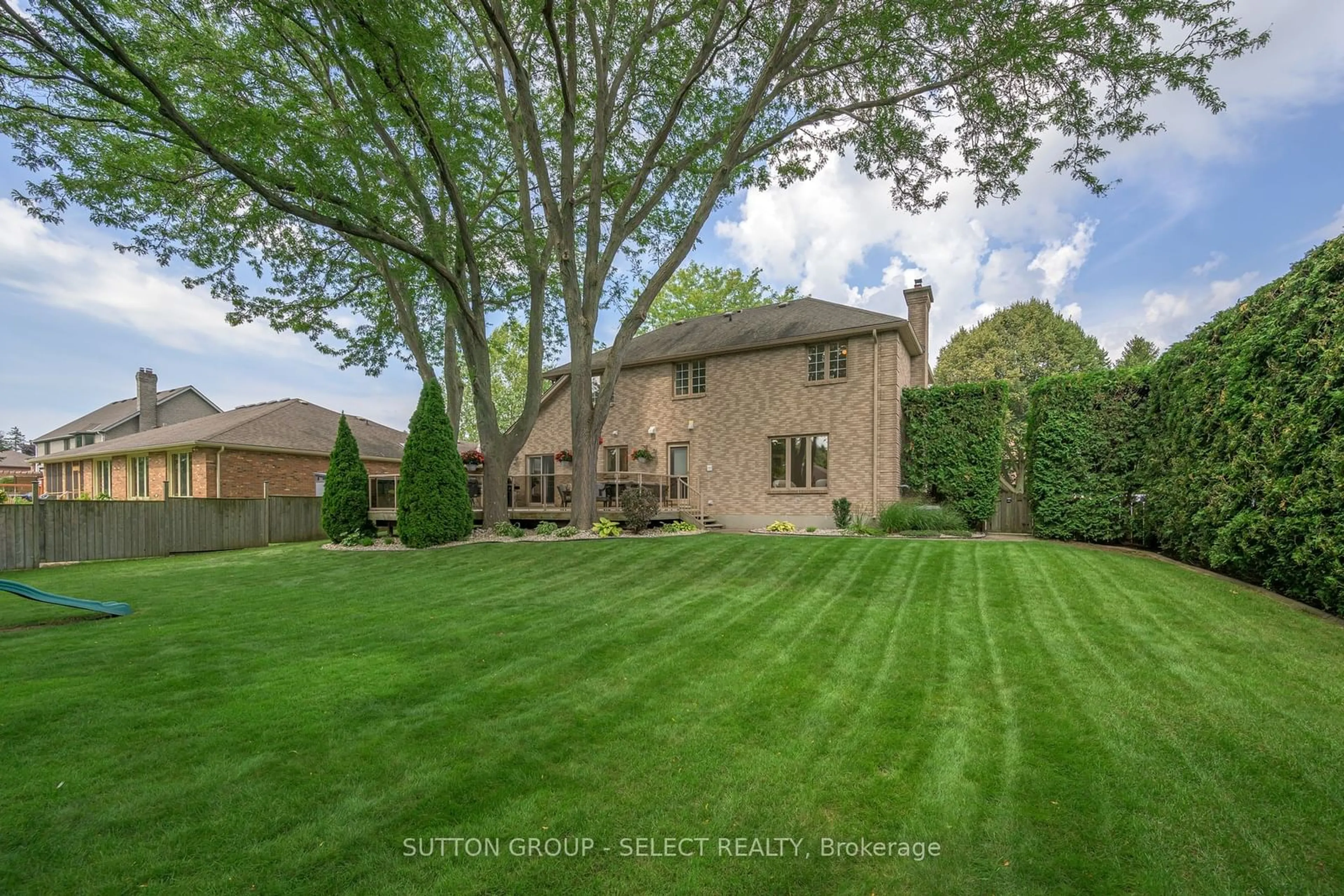 Frontside or backside of a home, the fenced backyard for 6907 Lambeth Walk, London Ontario N6P 1A5