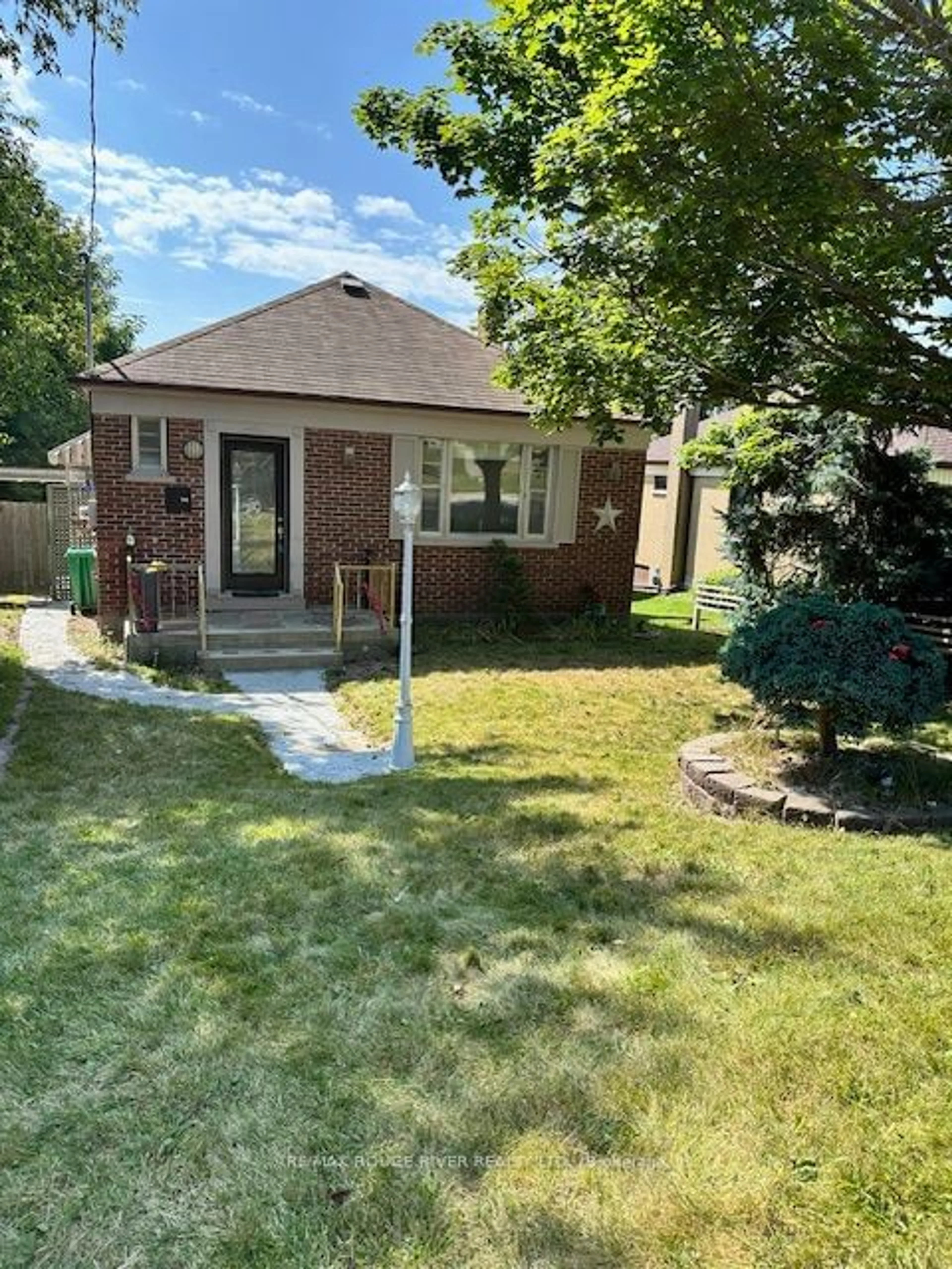 Frontside or backside of a home, the fenced backyard for 785 Frank St, Peterborough Ontario K9J 4N1