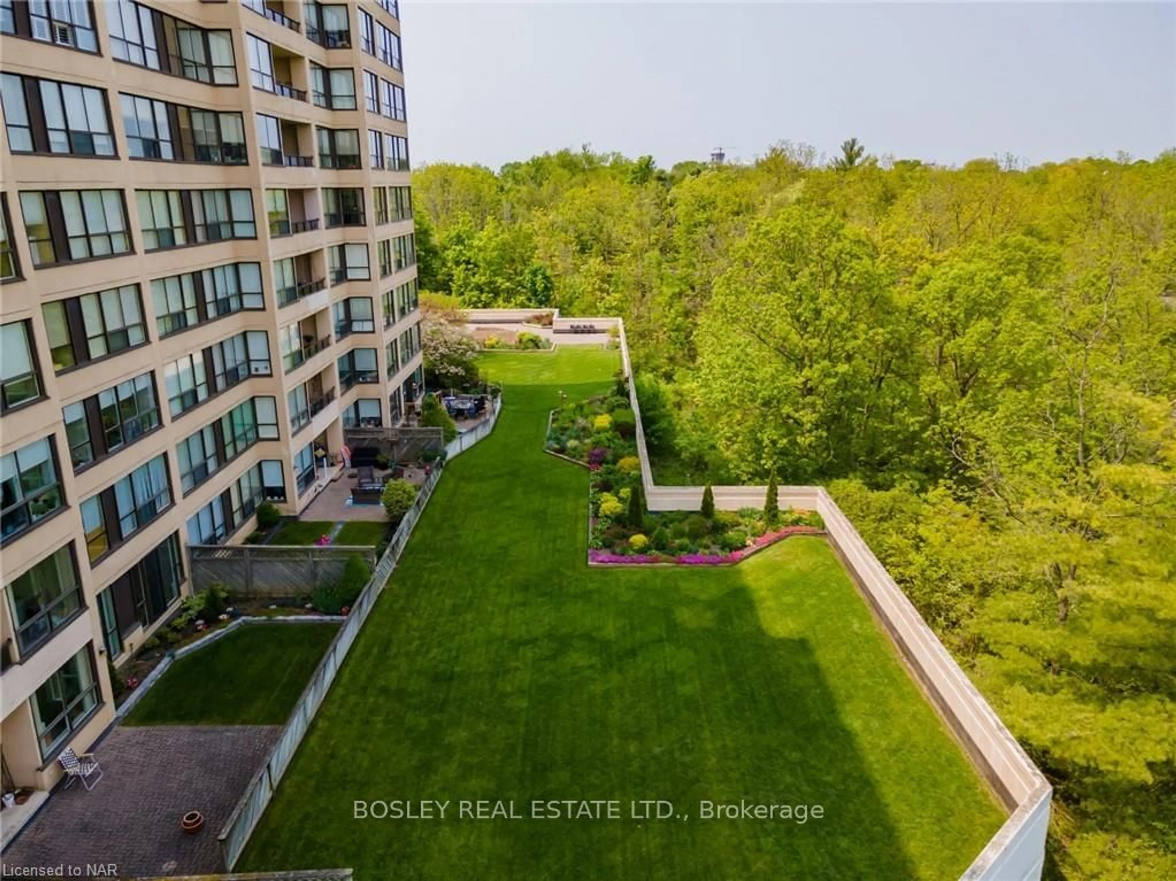 A pic from exterior of the house or condo, the fenced backyard for 3 Towering Hts Blvd #605, St. Catharines Ontario L2T 4A4