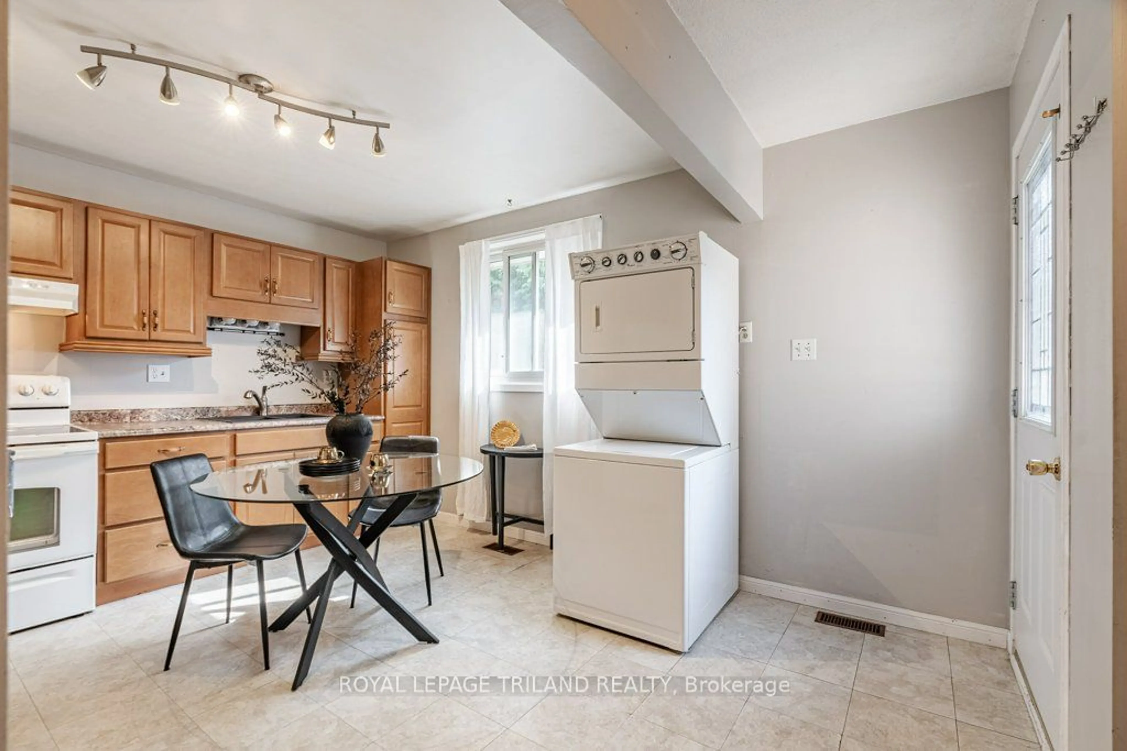 Kitchen with laundary machines, wood floors for 35 Caprice Cres, London Ontario N5V 3L9