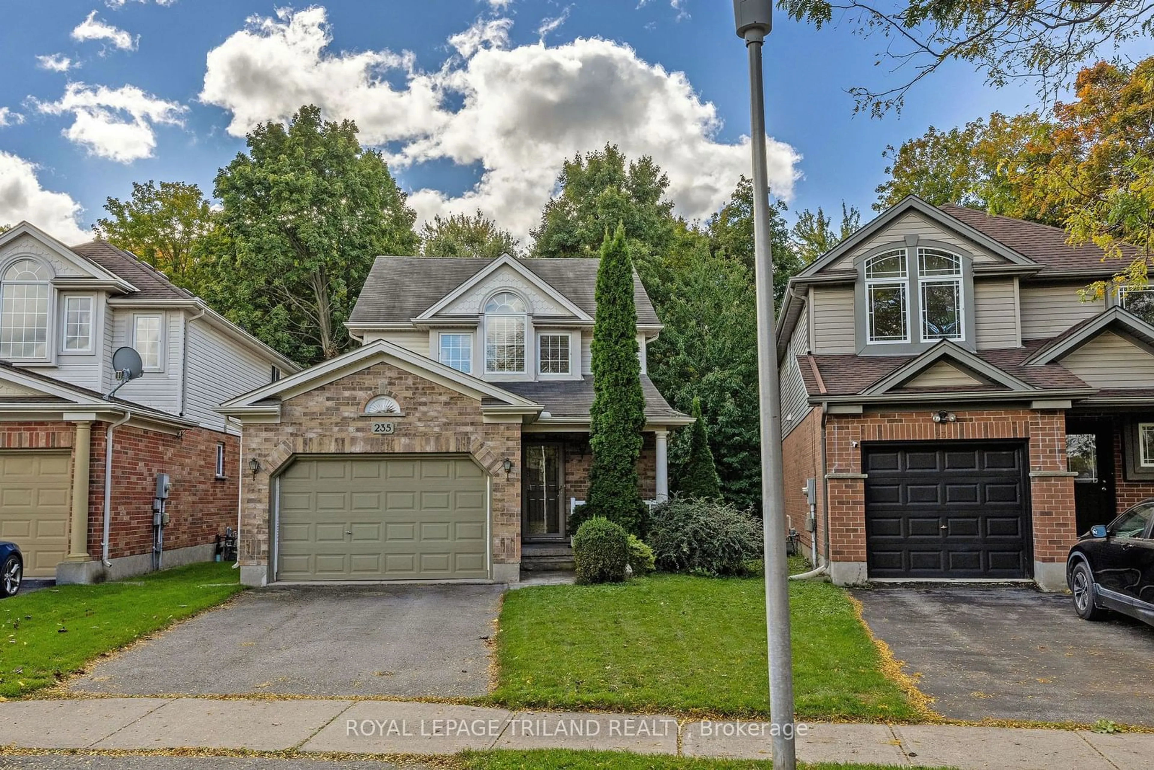 A pic from exterior of the house or condo, the street view for 235 Rossmore Crt, London Ontario N6C 6B7