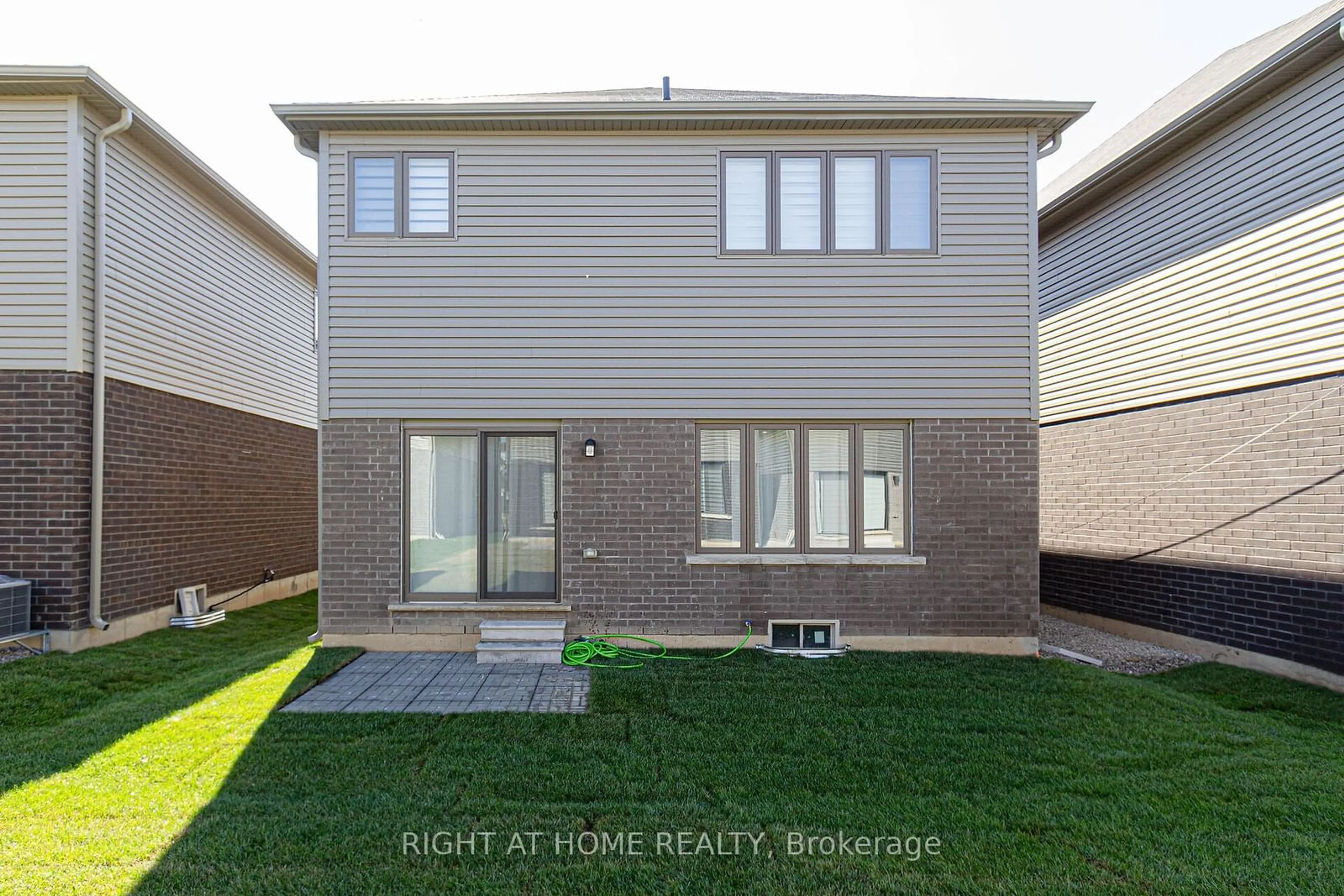 Frontside or backside of a home, the fenced backyard for 10 Broddy Ave, Brantford Ontario L3T 0V2