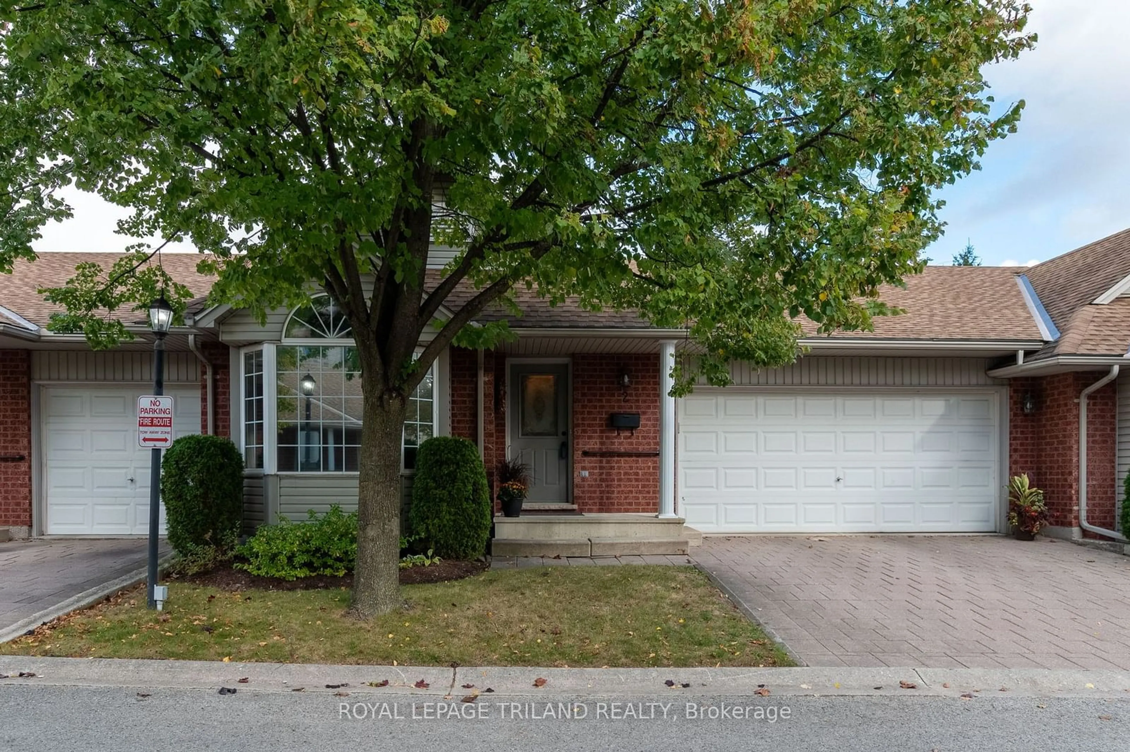 A pic from exterior of the house or condo, the street view for 122 Sherwood Forest Sq #2, London Ontario N6G 5G8