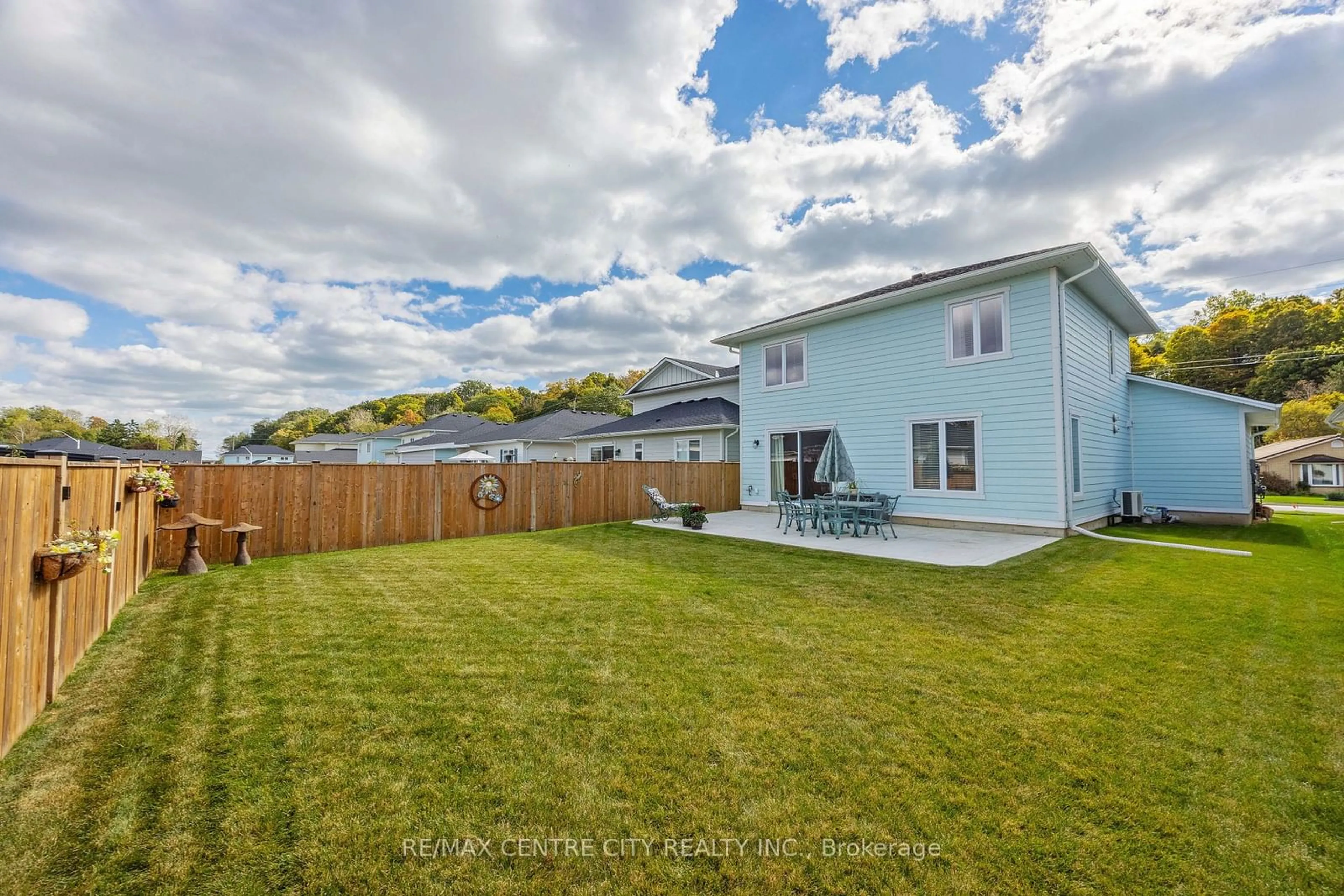 Frontside or backside of a home, the fenced backyard for 429 George St, Central Elgin Ontario N5L 1G4