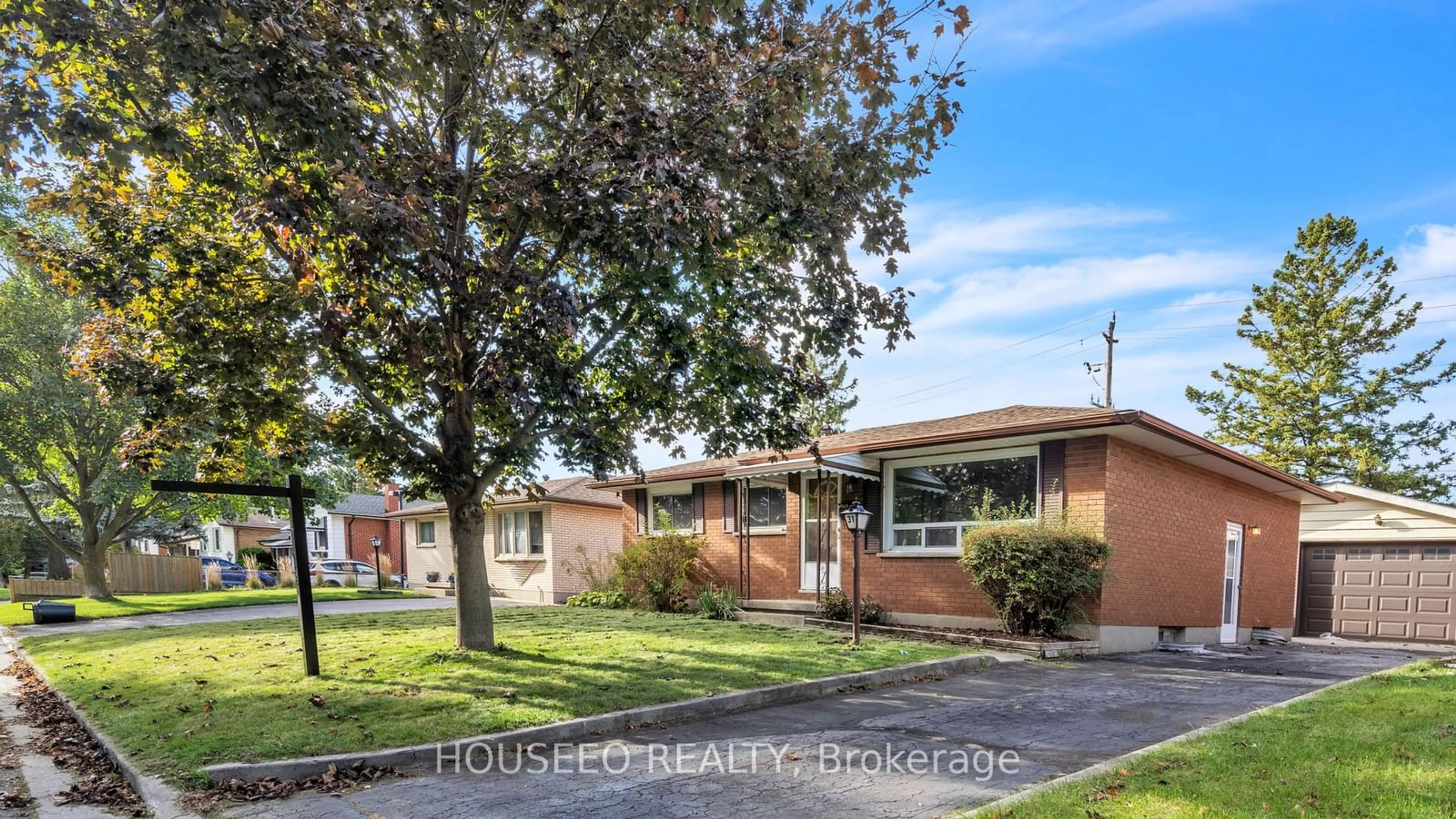 Frontside or backside of a home, the fenced backyard for 31 Genevive Cres, London Ontario N5Y 4A7