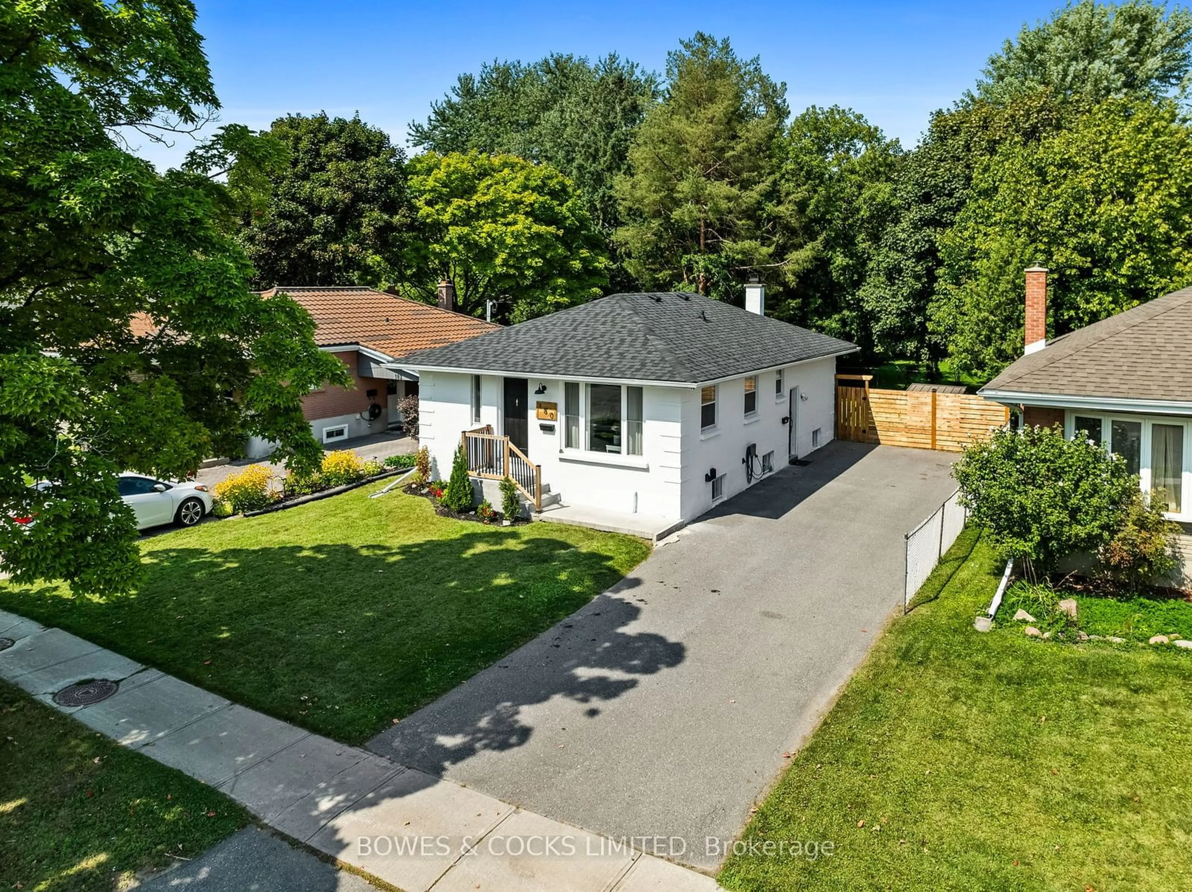 Frontside or backside of a home, the fenced backyard for 180 McClennan St, Peterborough Ontario K9H 5H7