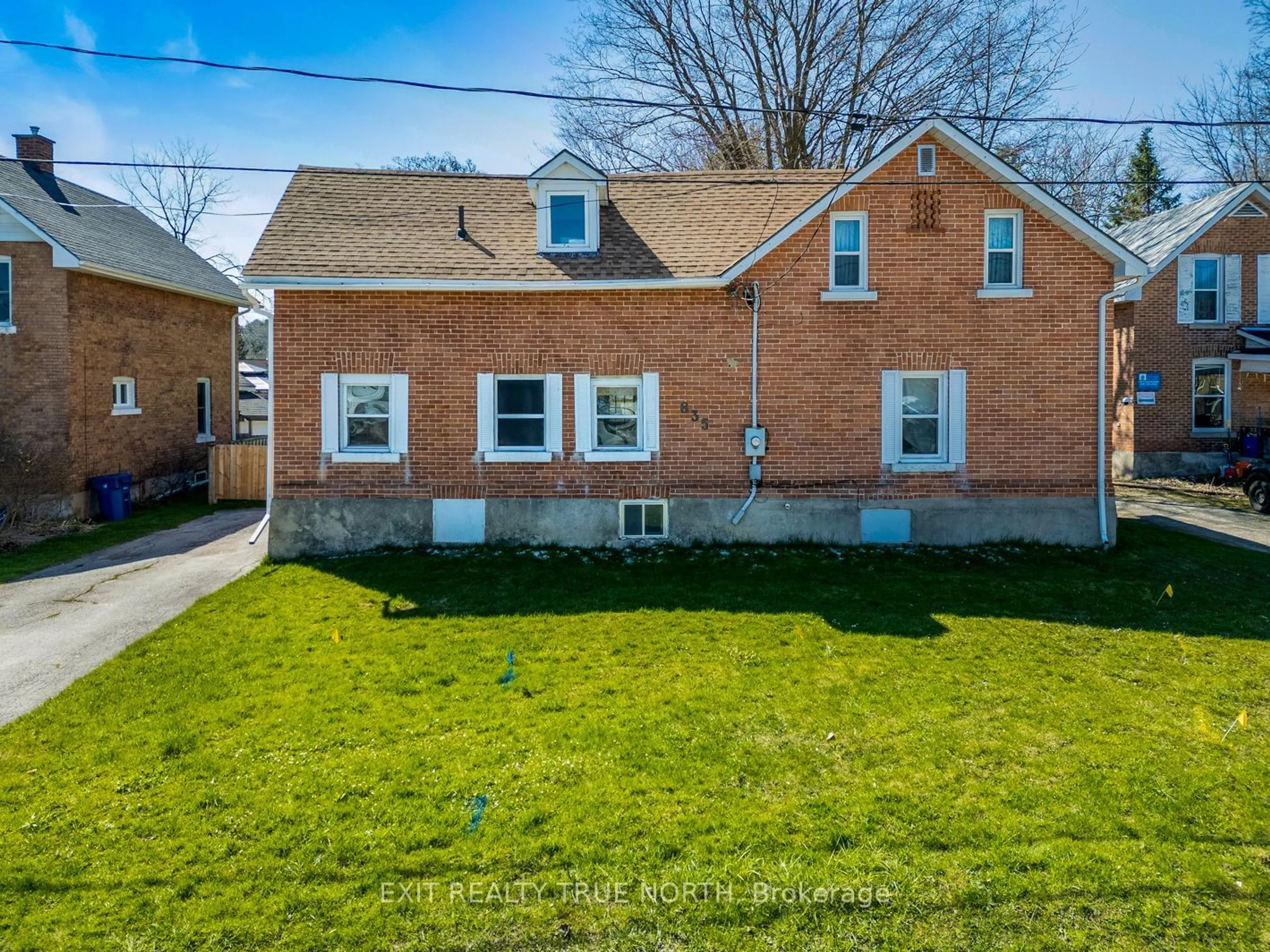 Frontside or backside of a home, the fenced backyard for 835 11th St, Owen Sound Ontario N4K 3T4