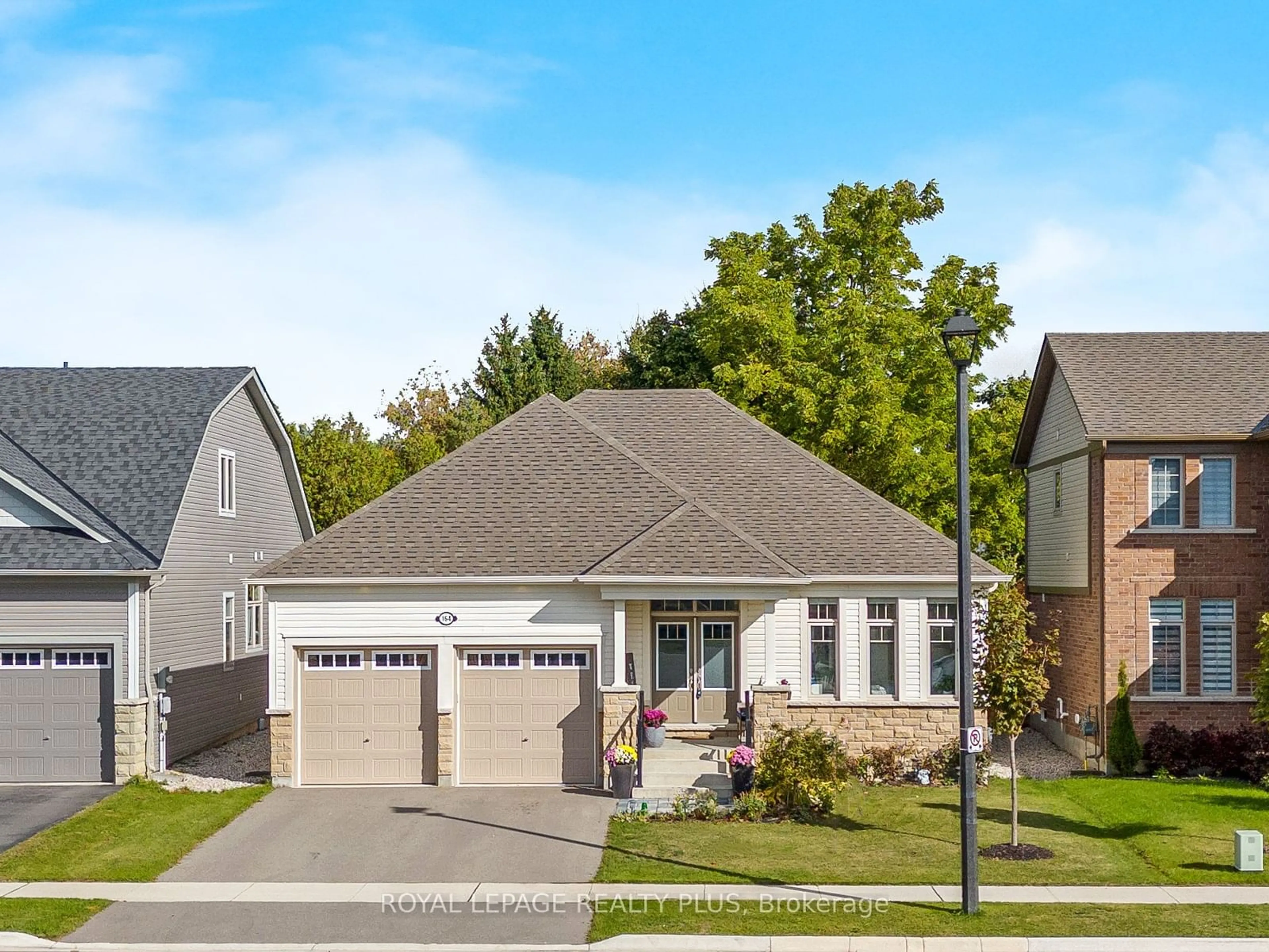 Frontside or backside of a home, the street view for 164 Harpin Way, Centre Wellington Ontario N1M 0G8