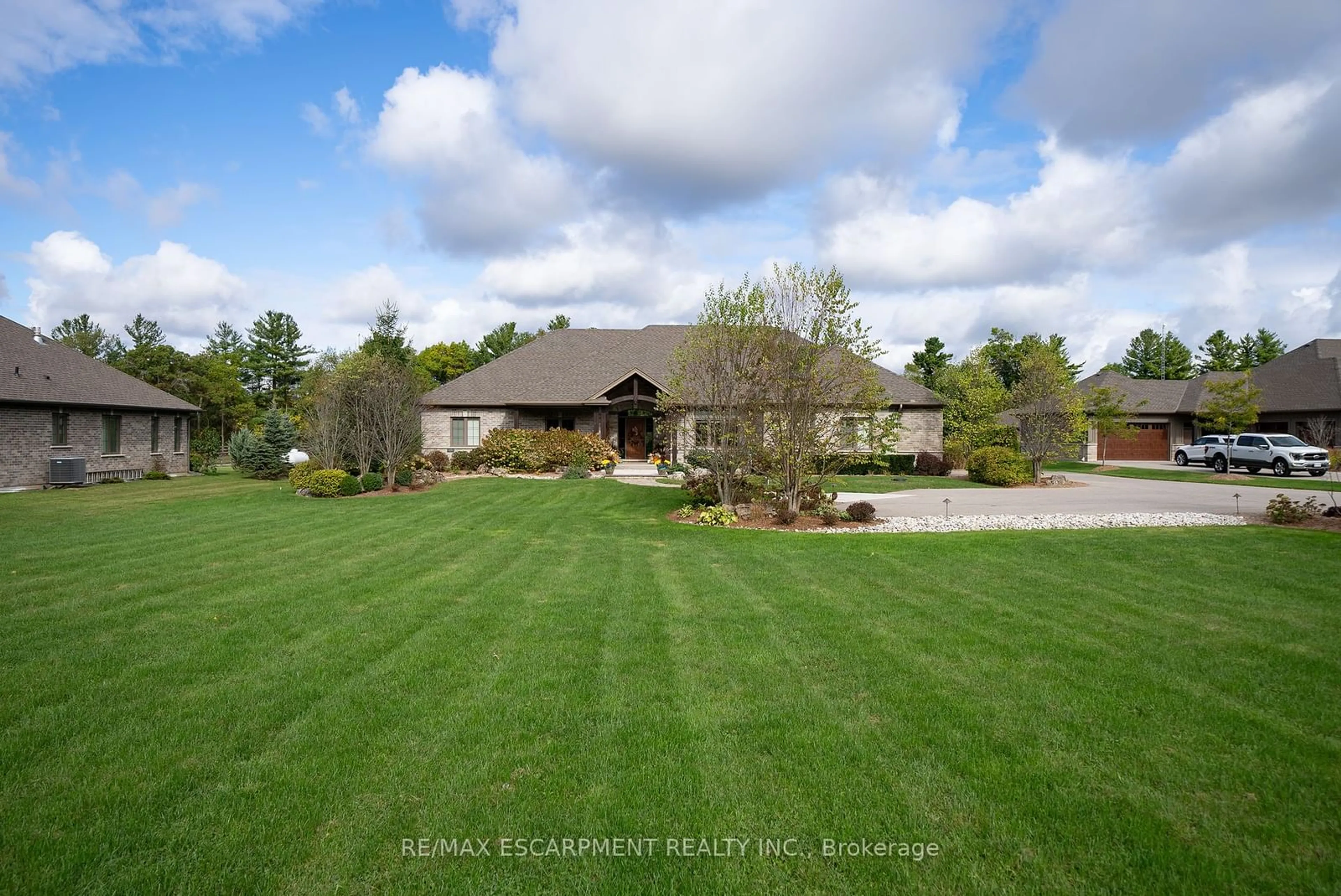 Frontside or backside of a home, the fenced backyard for 523 Blue Lake Rd, Brant Ontario N0E 1N0