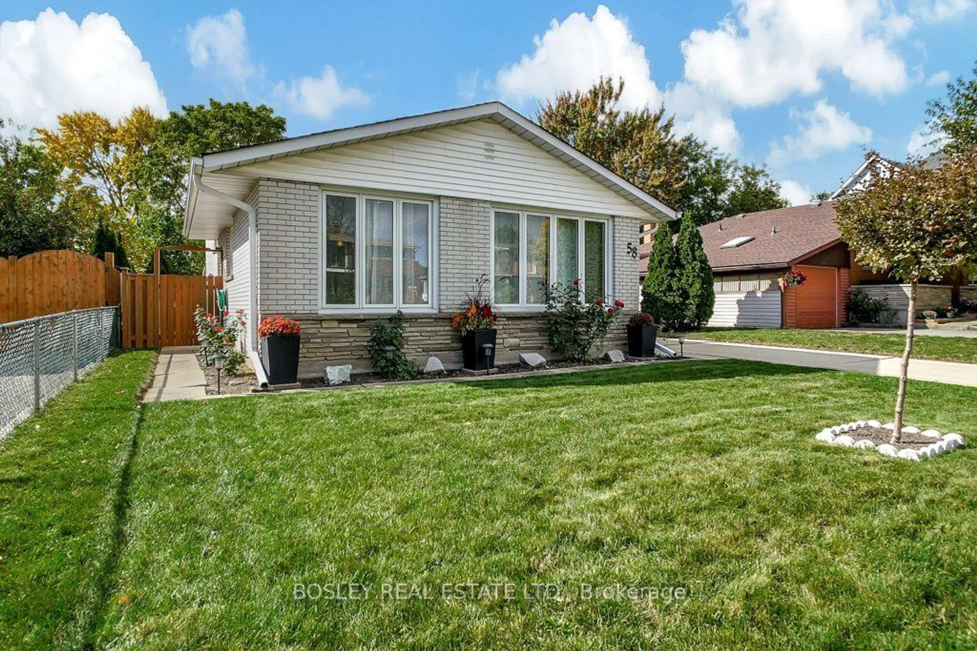 Frontside or backside of a home, the fenced backyard for 58 Secord Ave, Kitchener Ontario N2B 2L4