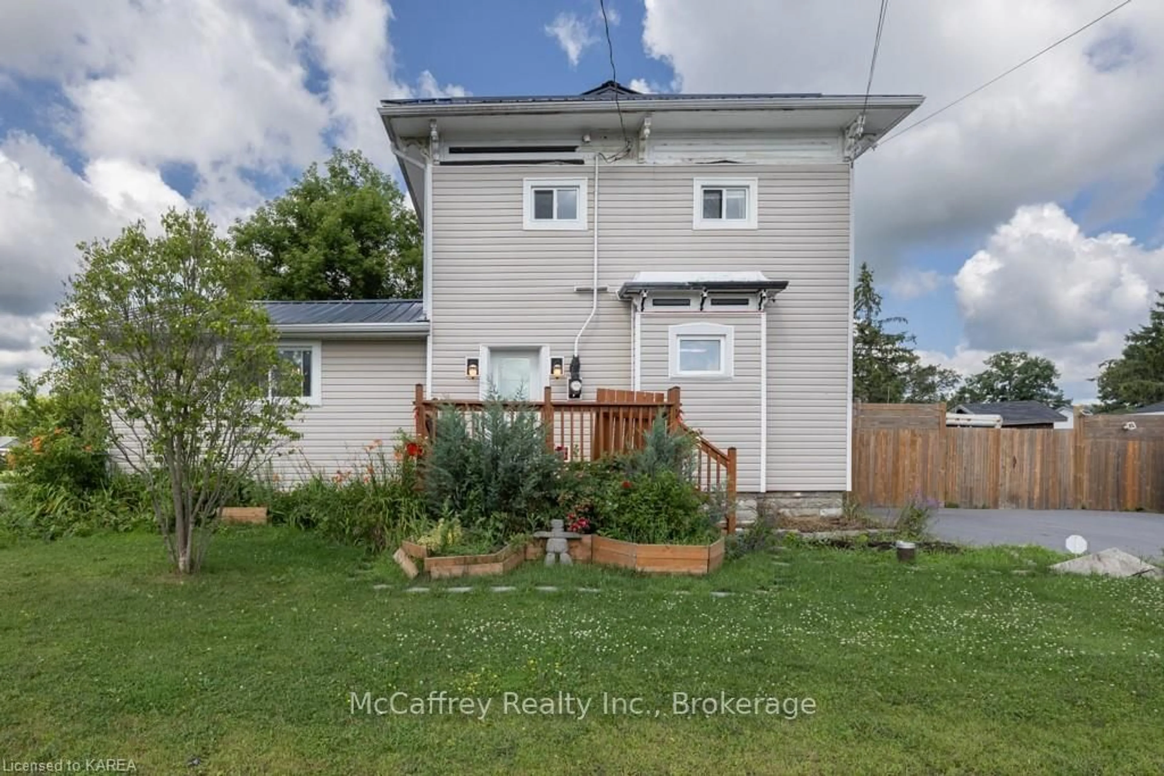 Frontside or backside of a home, the fenced backyard for 4309 KINGSTON Rd, South Frontenac Ontario K0H 1V0