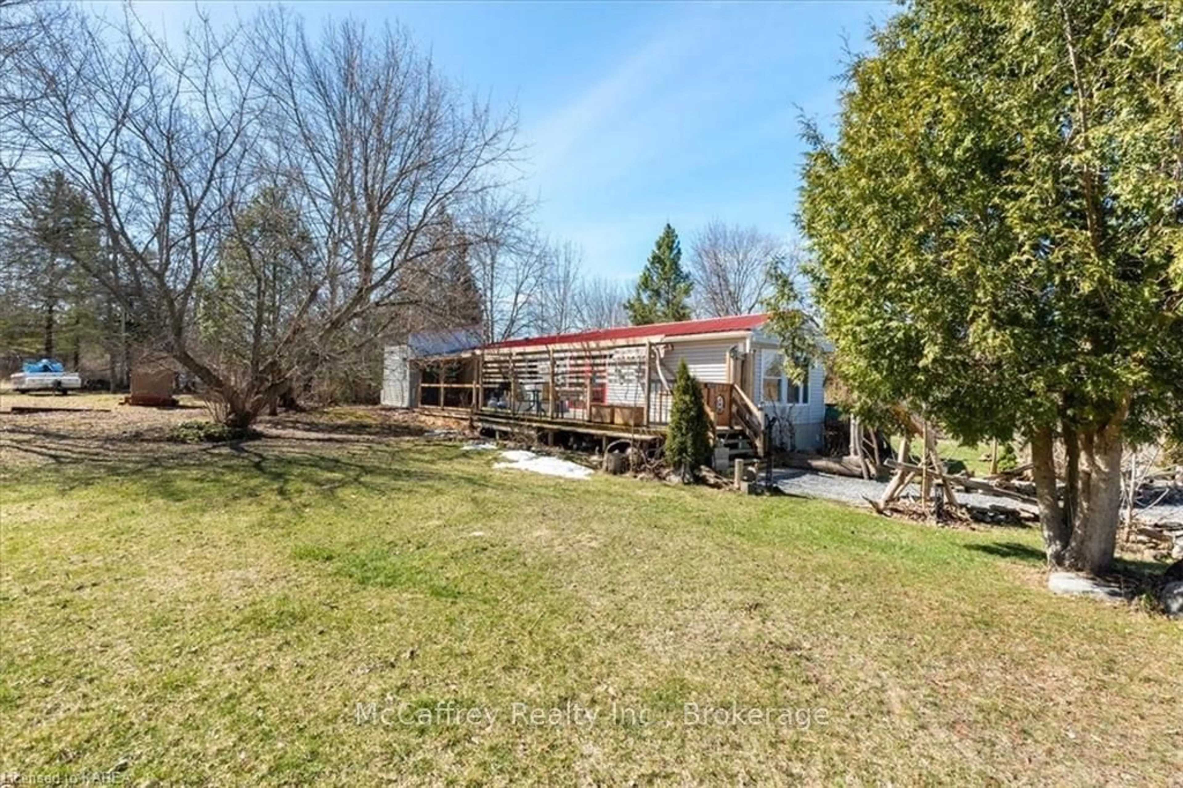 Frontside or backside of a home, the fenced backyard for 218 OAK Lane, Trent Hills Ontario K0K 2M0