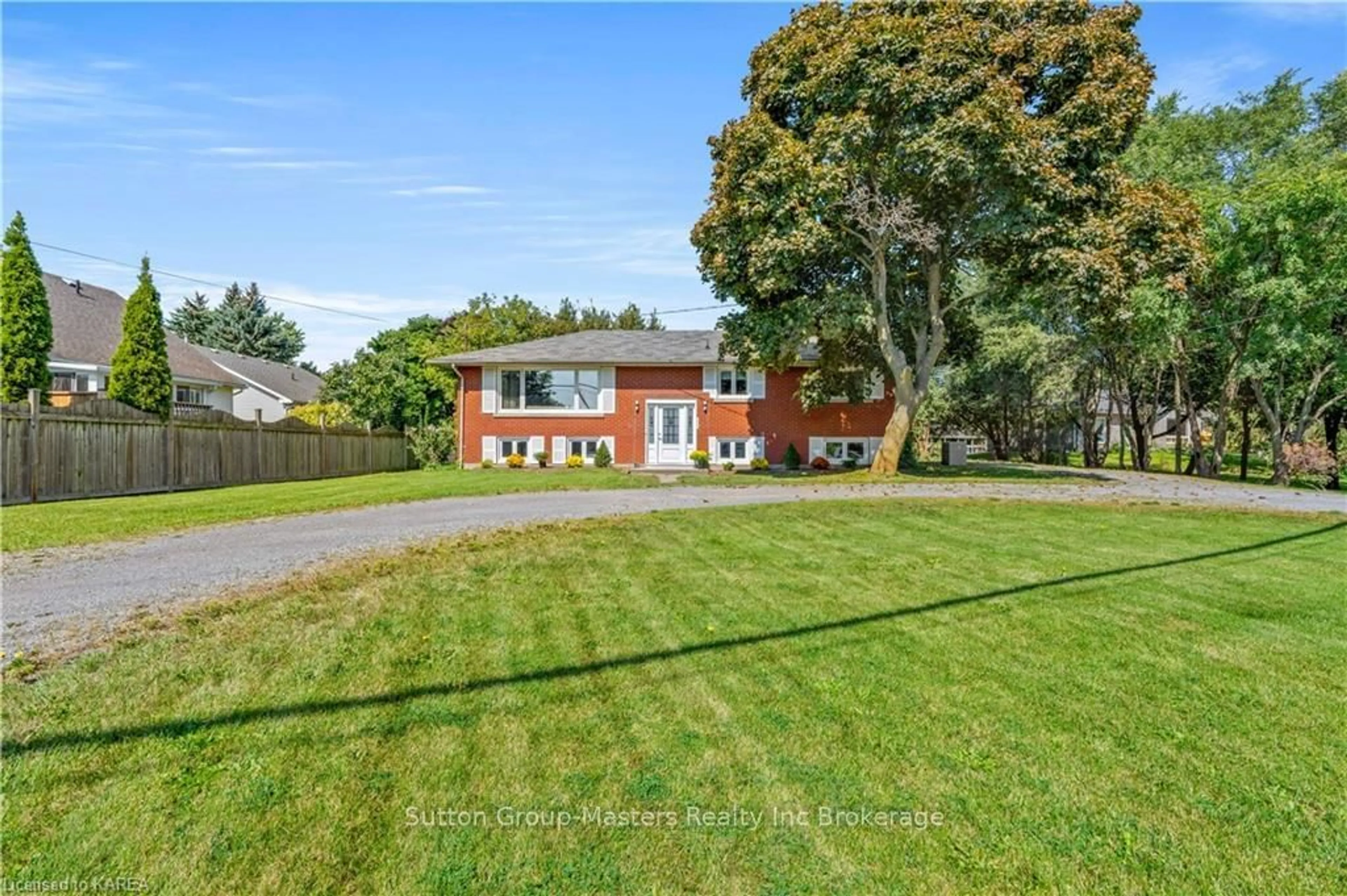 Frontside or backside of a home, the fenced backyard for 518 MAIN St, Loyalist Ontario K0H 1G0