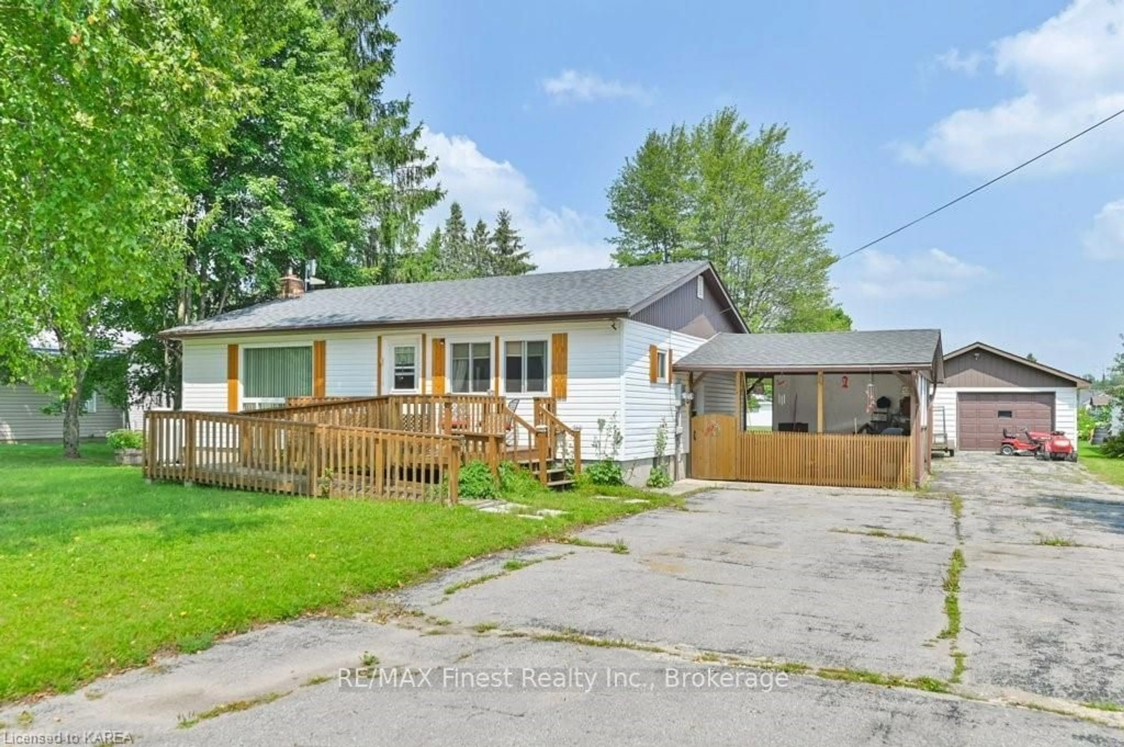 Frontside or backside of a home, the fenced backyard for 35 JOHN St, Addington Highlands Ontario K0H 1P0