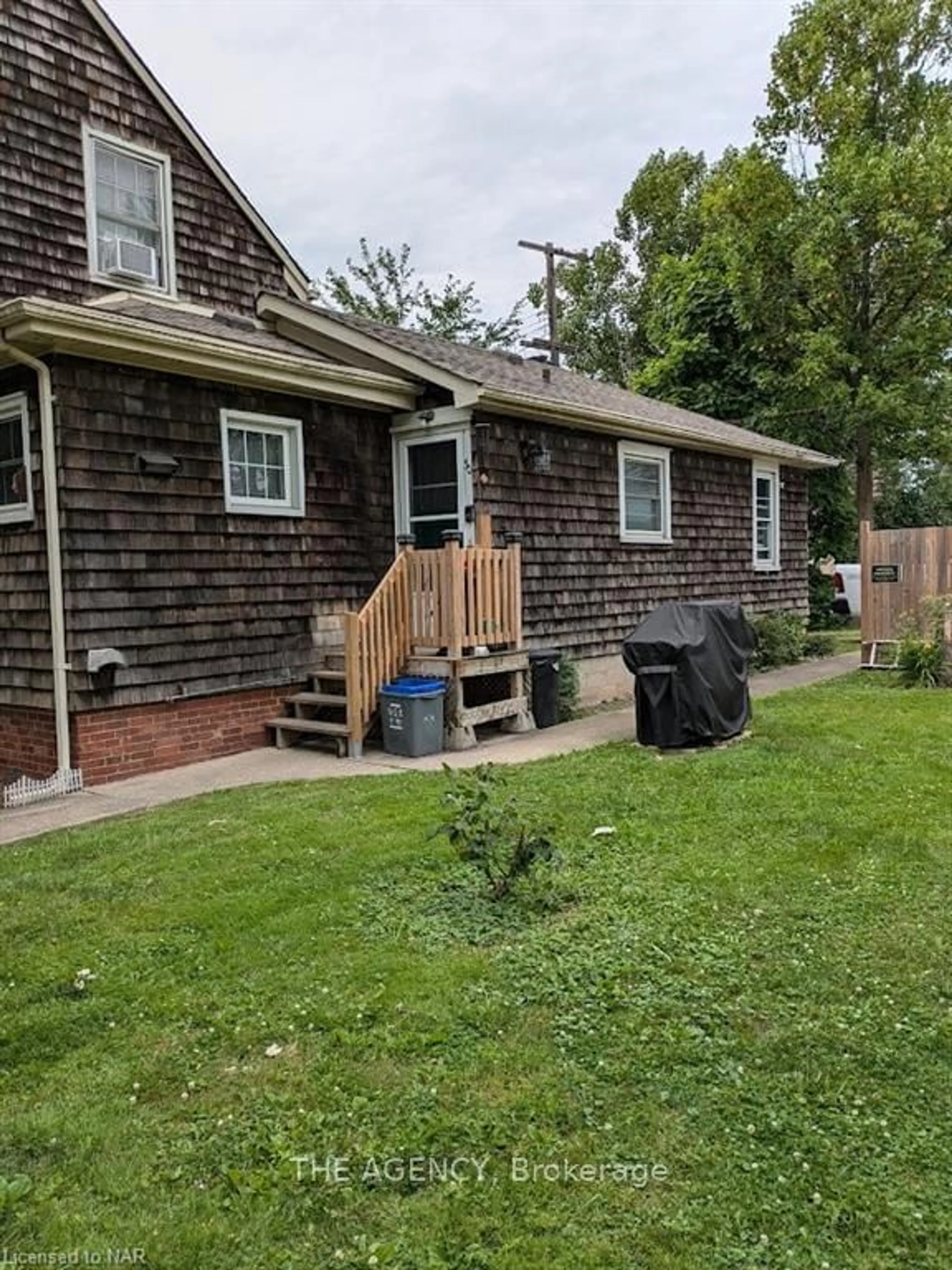 Frontside or backside of a home, the fenced backyard for 30 FIRST St, Welland Ontario L3B 4R9