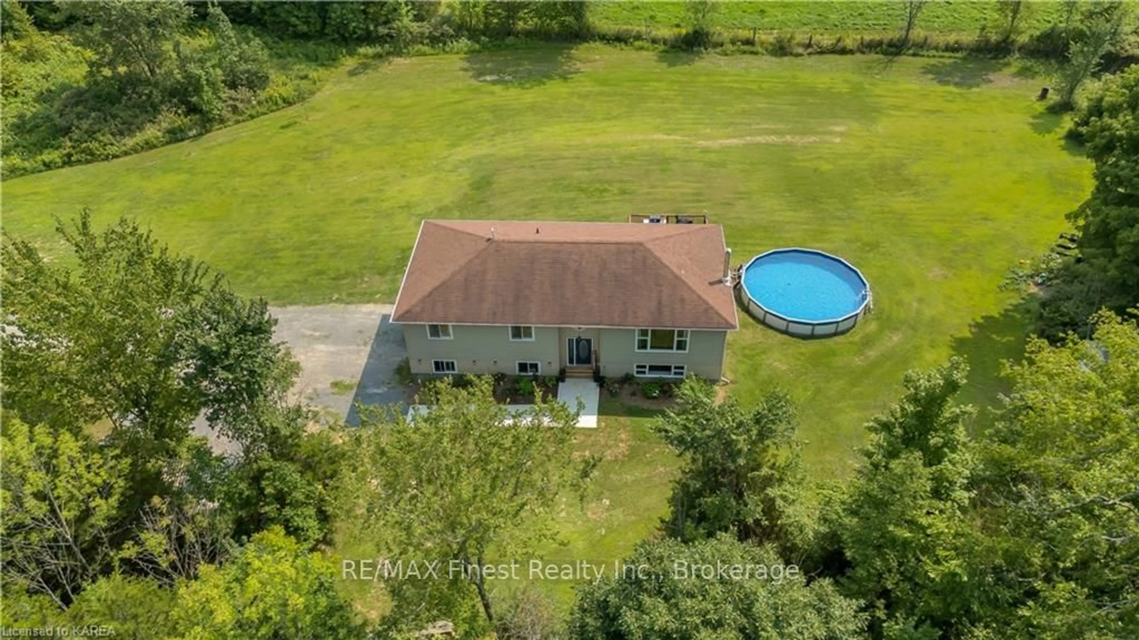 Frontside or backside of a home, the fenced backyard for 5844 WILMER Rd, South Frontenac Ontario K0H 2L0