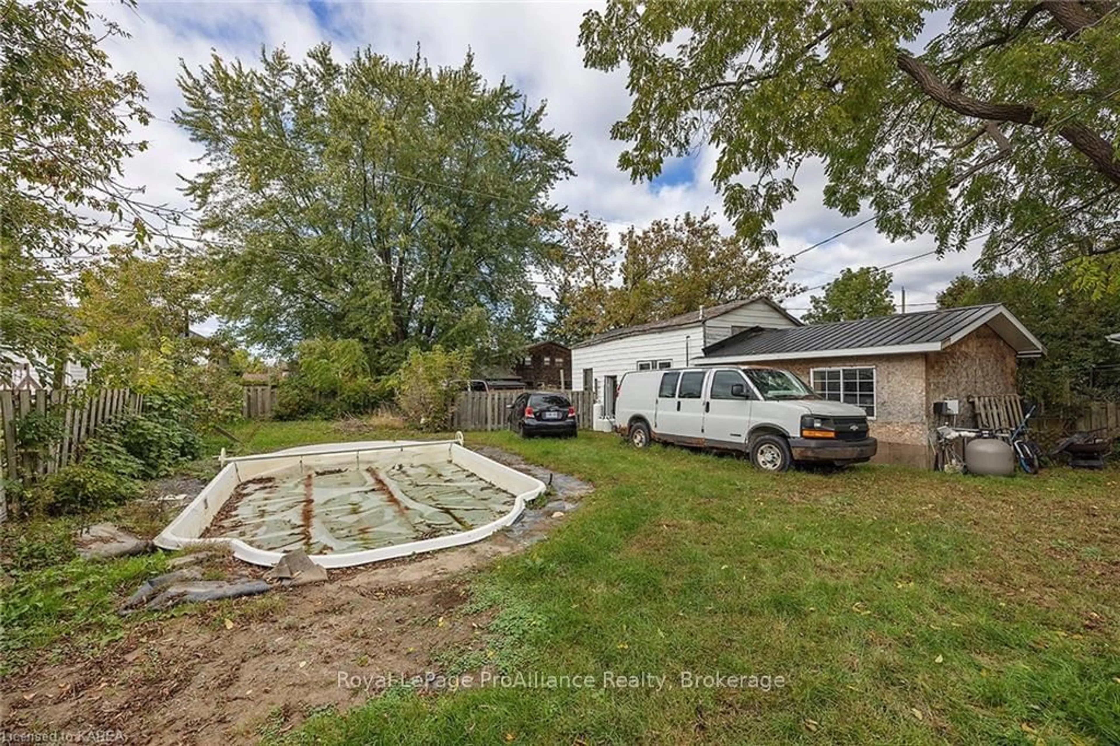 Frontside or backside of a home, the fenced backyard for 308 BROCK St, Gananoque Ontario K7G 1K6